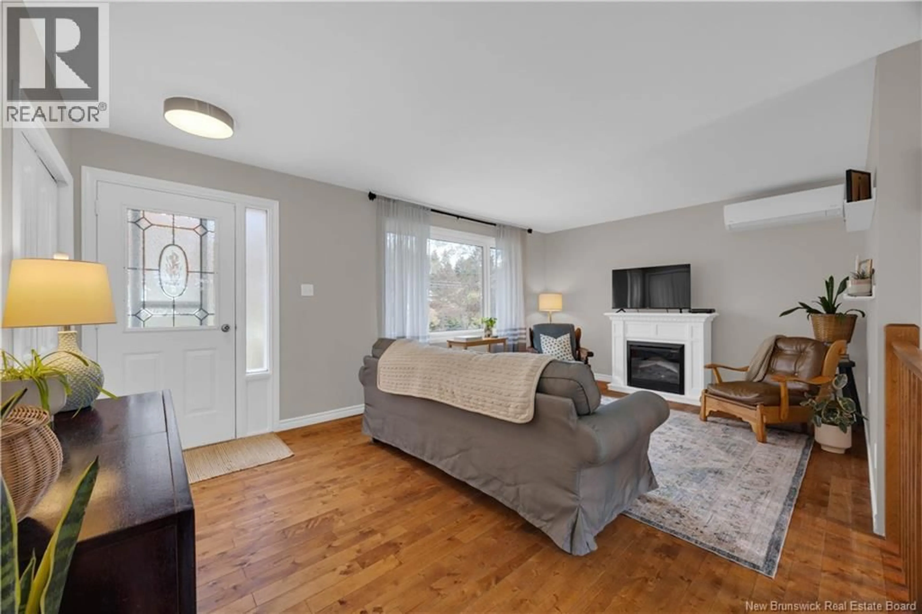 Living room with furniture, wood/laminate floor for 141 PAULINE STREET, Saint John New Brunswick E2J3K8