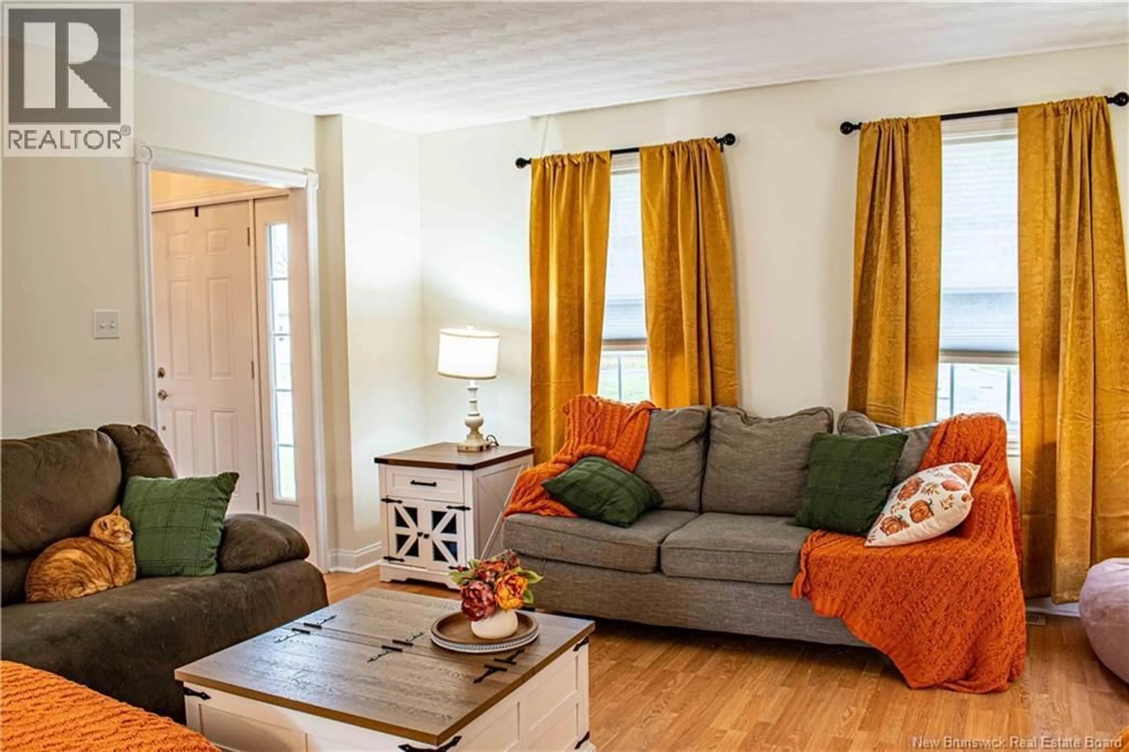 Living room with furniture, wood/laminate floor for 5 ALLISON COURT, Oromocto New Brunswick E3V2M8