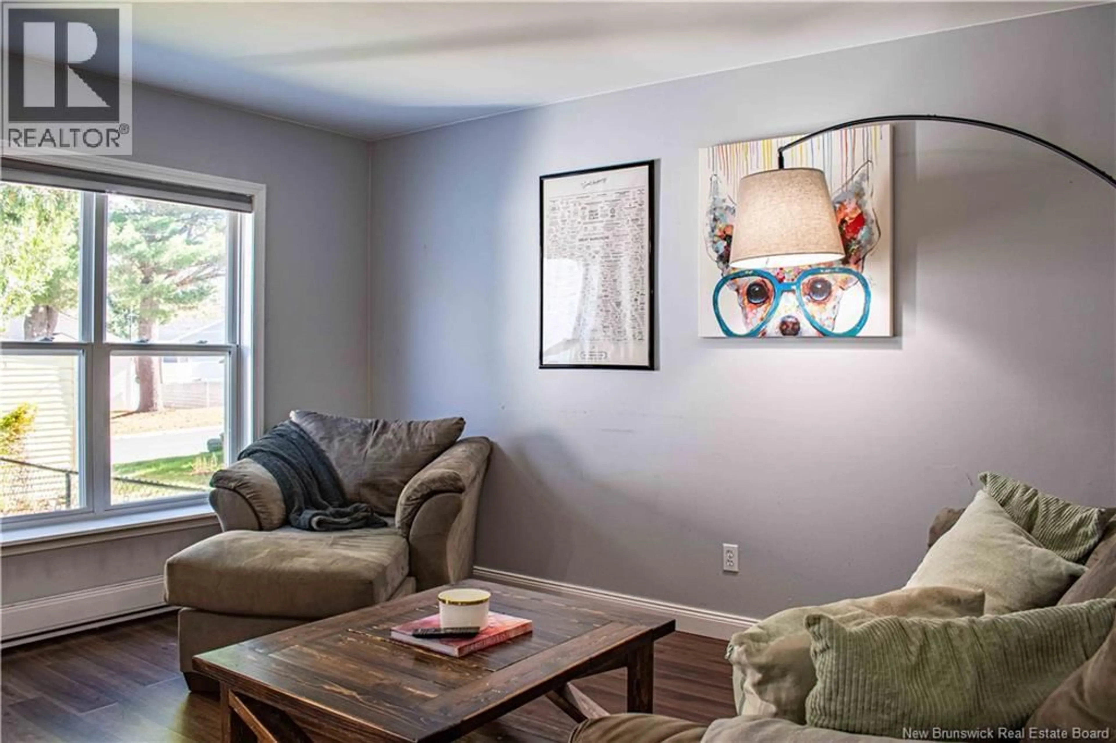 Living room with furniture, wood/laminate floor for 18 DEER PARK DRIVE, Oromocto New Brunswick E2V1J2