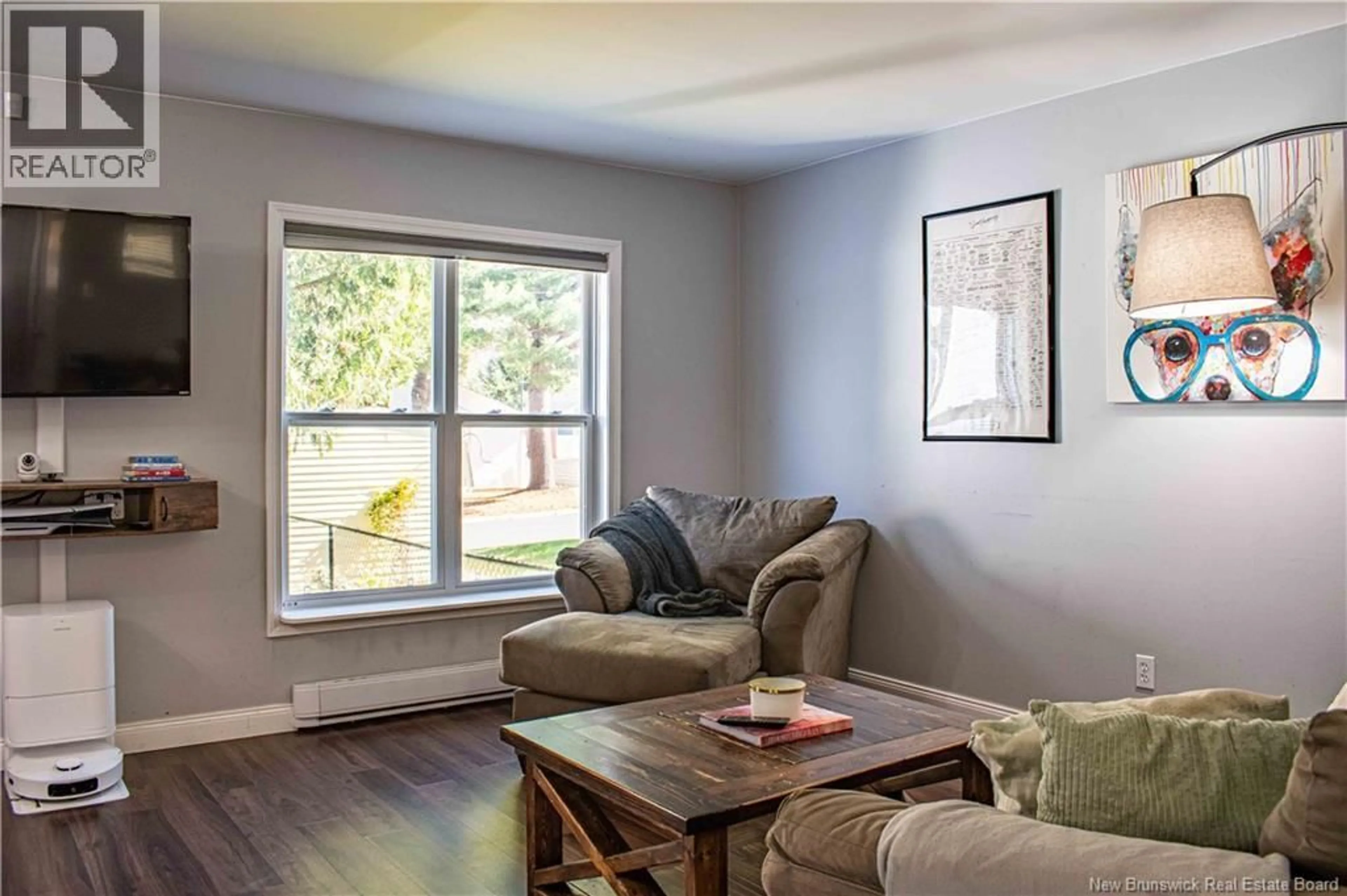 Living room with furniture, wood/laminate floor for 18 DEER PARK DRIVE, Oromocto New Brunswick E2V1J2