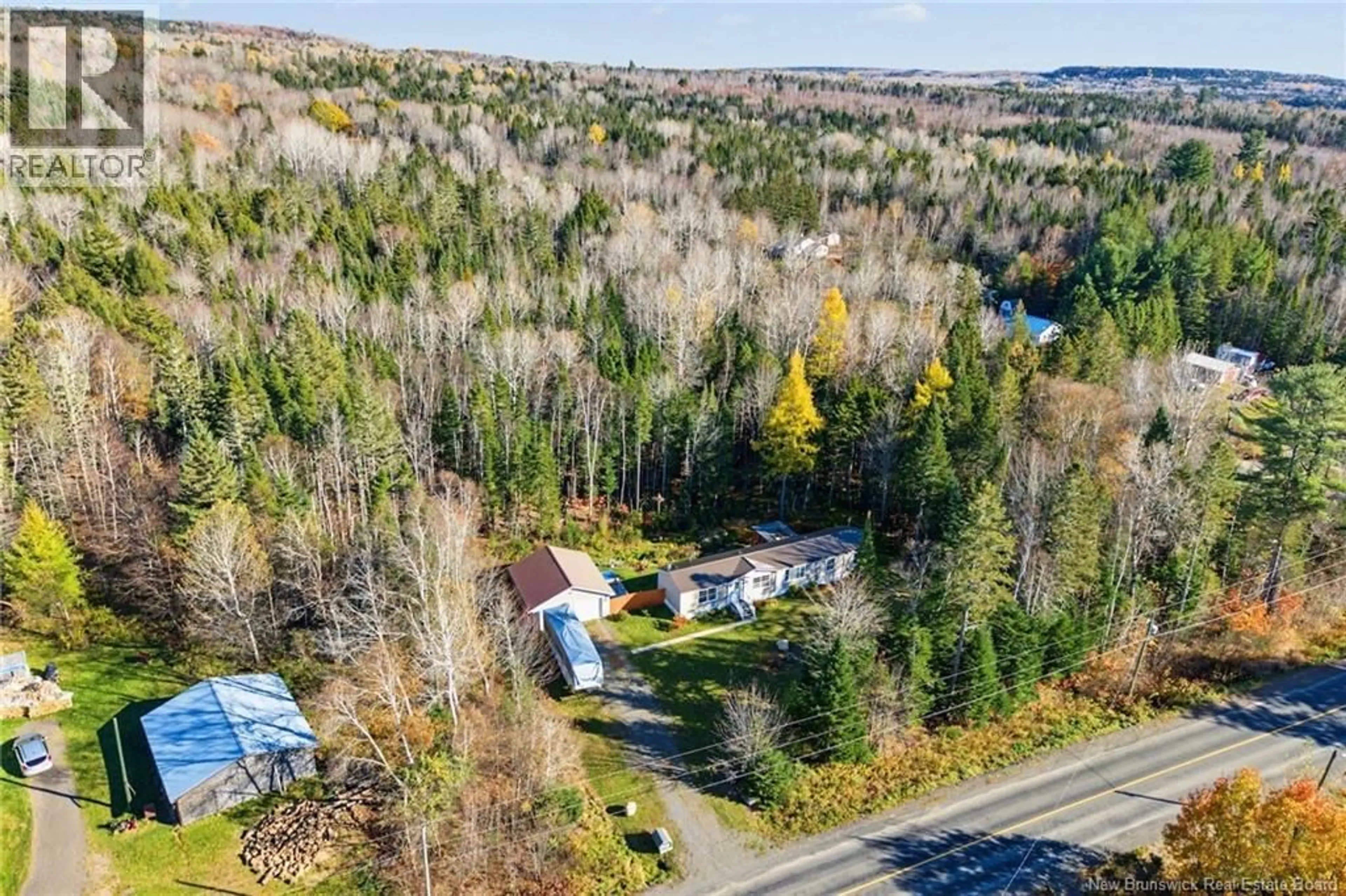 A pic from outside/outdoor area/front of a property/back of a property/a pic from drone, forest/trees view for 1072 RTE 628, Taymouth New Brunswick E6C2B7