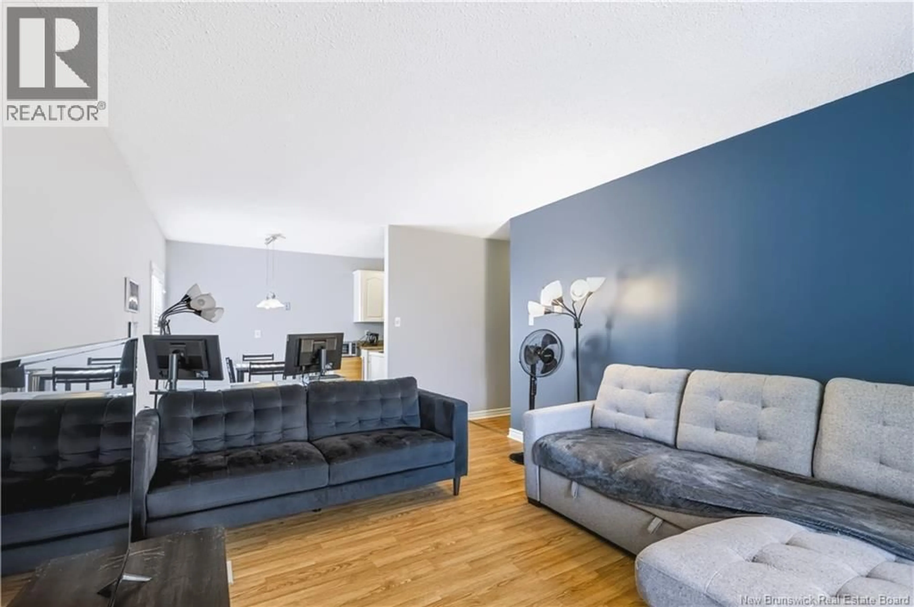 Living room with furniture, wood/laminate floor for 8 - 228 DUNNS CROSSING ROAD, Fredericton New Brunswick E3A2A6