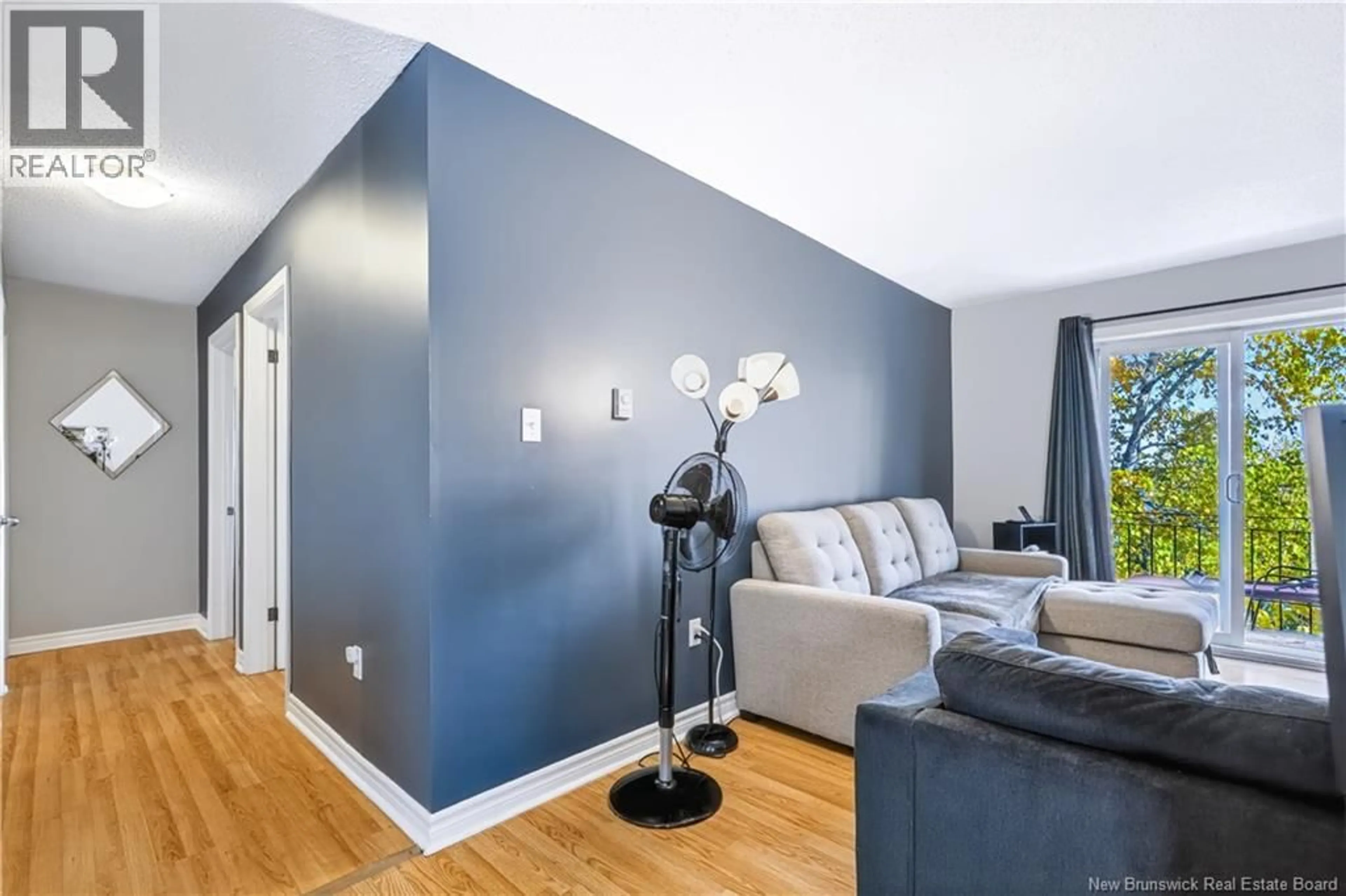 Living room with furniture, wood/laminate floor for 8 - 228 DUNNS CROSSING ROAD, Fredericton New Brunswick E3A2A6