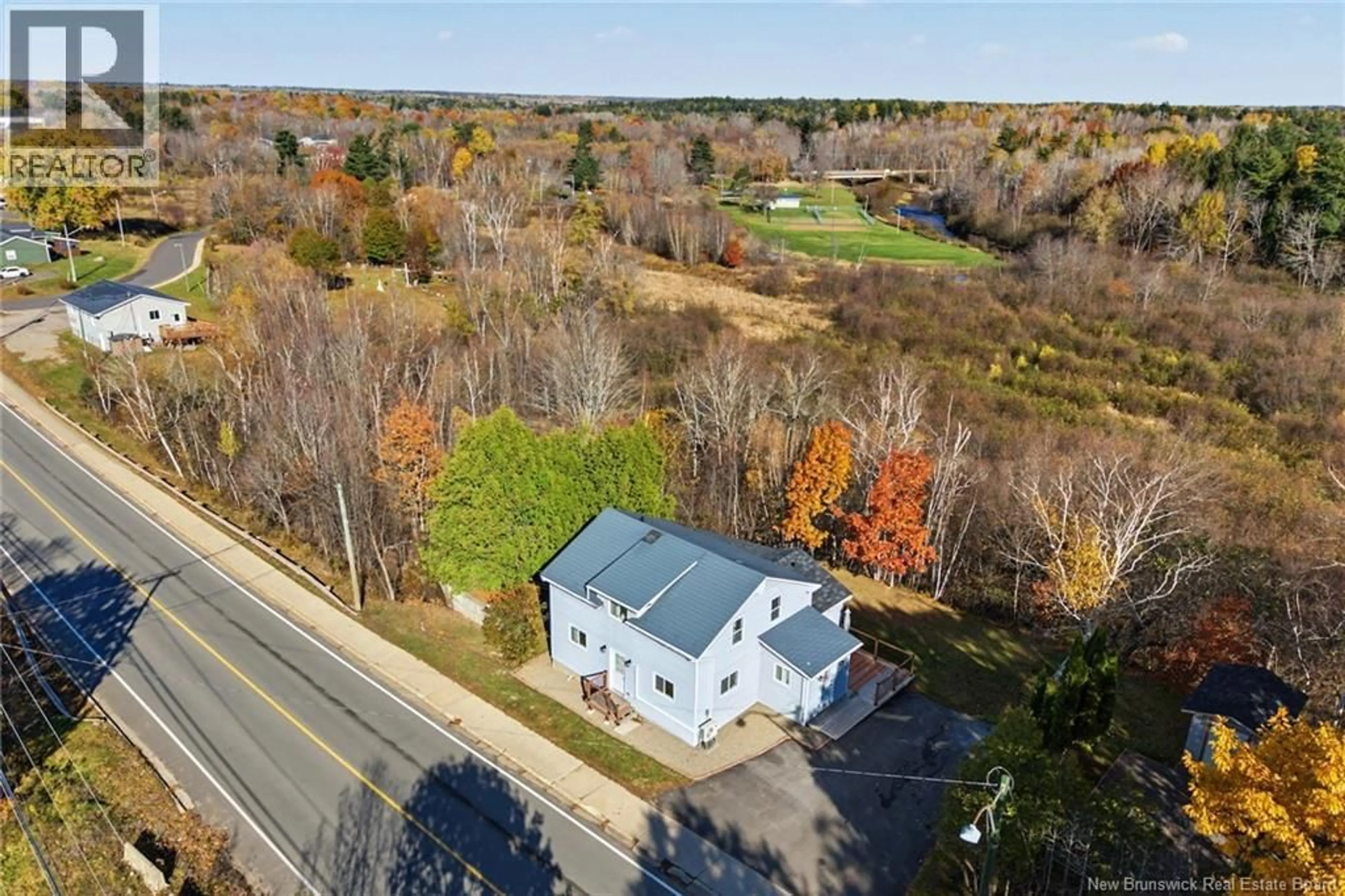 A pic from outside/outdoor area/front of a property/back of a property/a pic from drone, unknown for 56 MAIN STREET, Minto New Brunswick E4B3K5