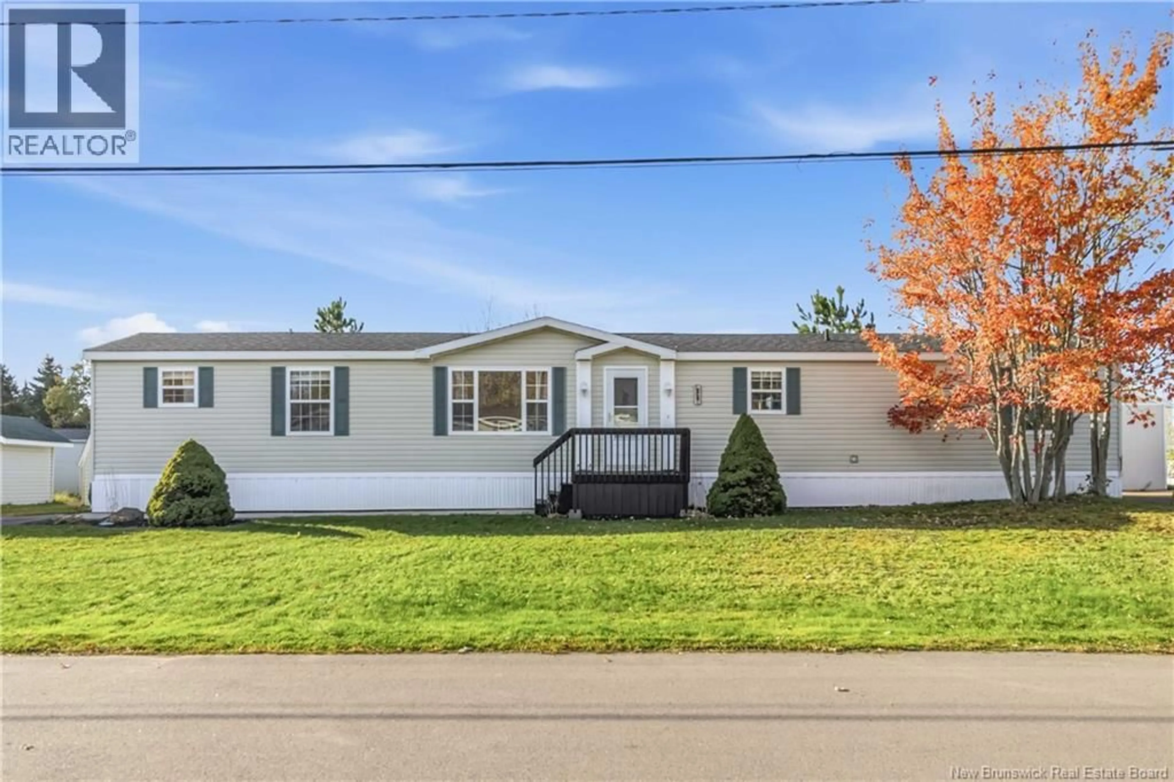 Home with vinyl exterior material, street for 25 ST JEAN, Dieppe New Brunswick E1A7N1