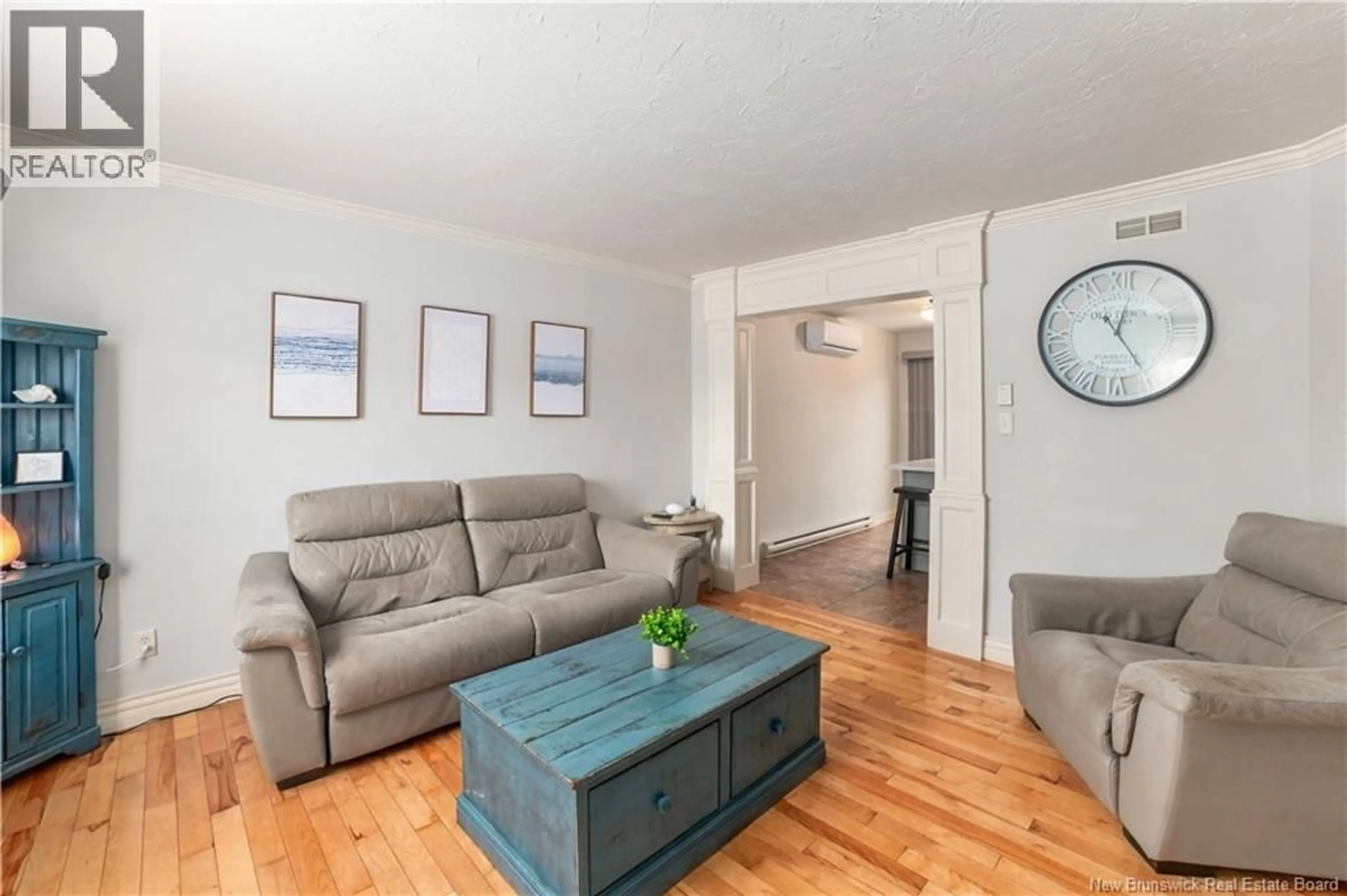 Living room with furniture, wood/laminate floor for 131 TEABERRY AVENUE, Moncton New Brunswick E1G0E8