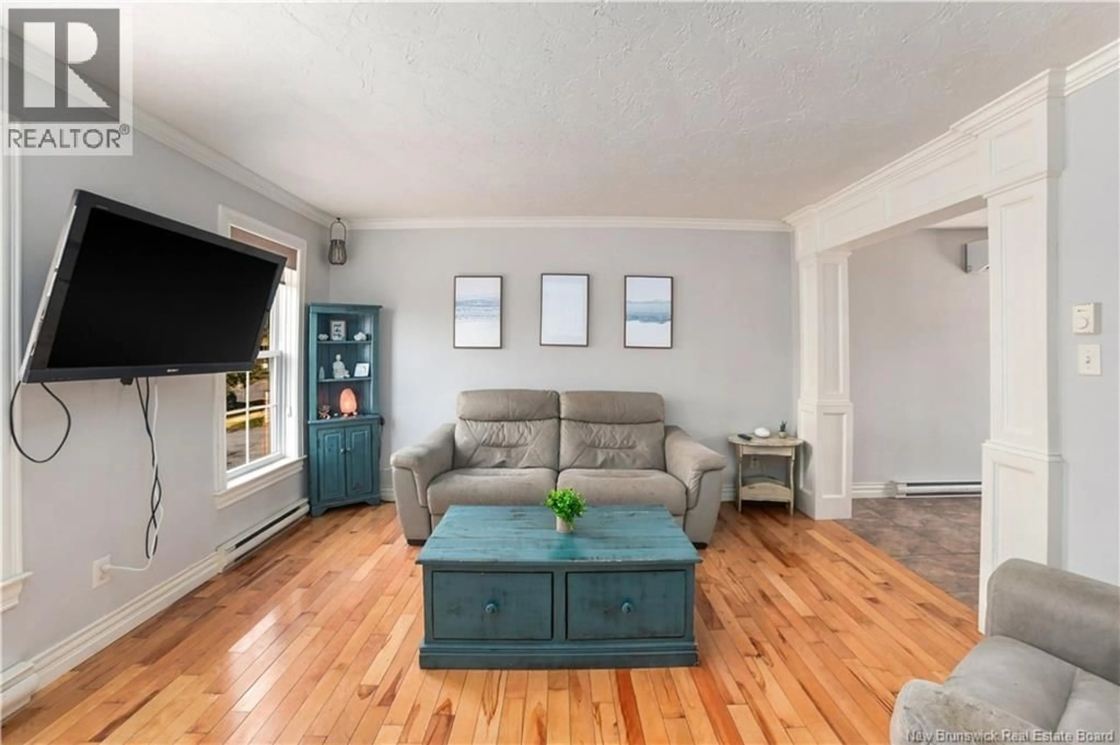 Living room with furniture, wood/laminate floor for 131 TEABERRY AVENUE, Moncton New Brunswick E1G0E8