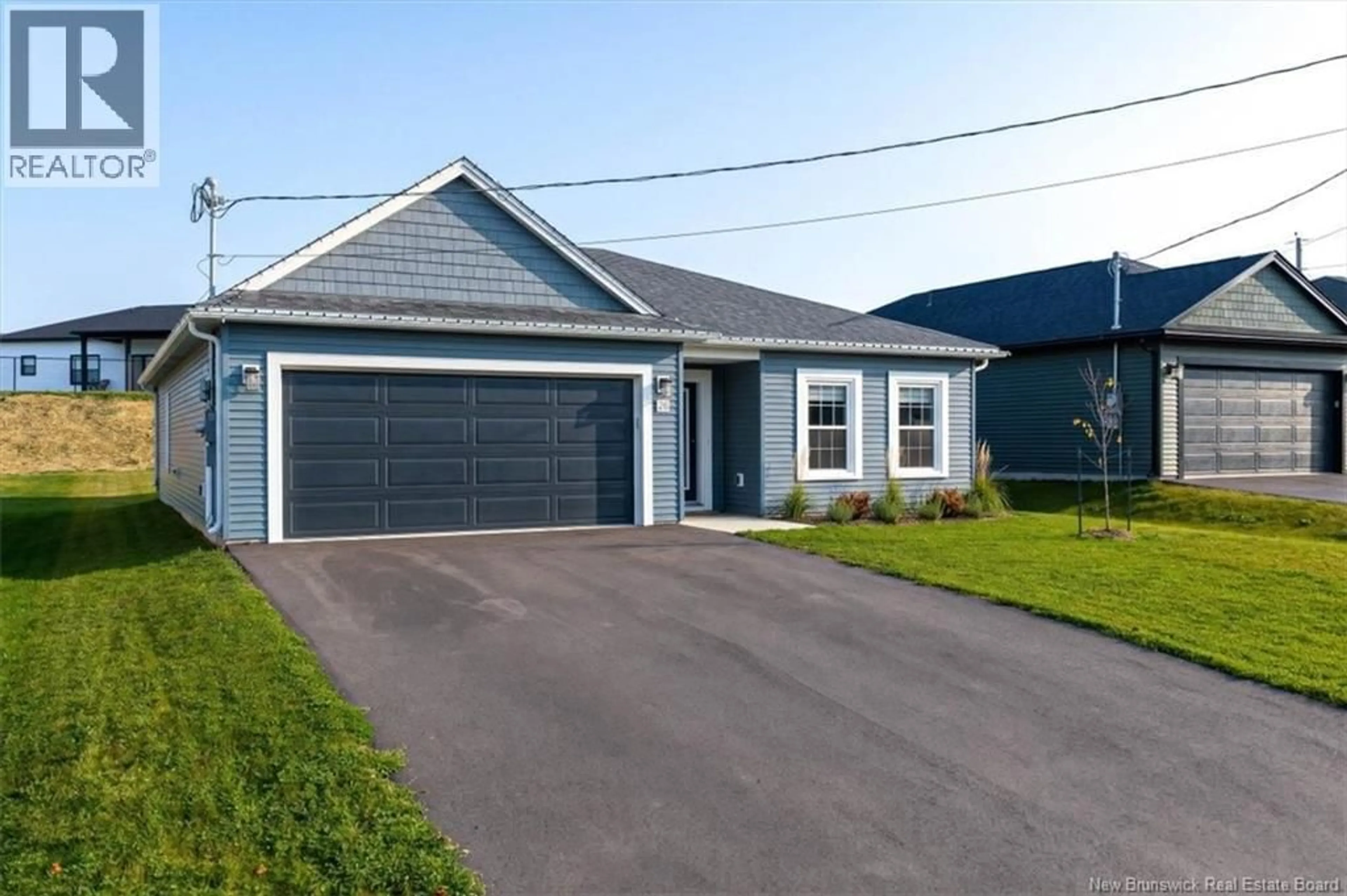 Home with vinyl exterior material, street for 26 BUCHANAN DRIVE, Sussex Corner New Brunswick E4E0B6