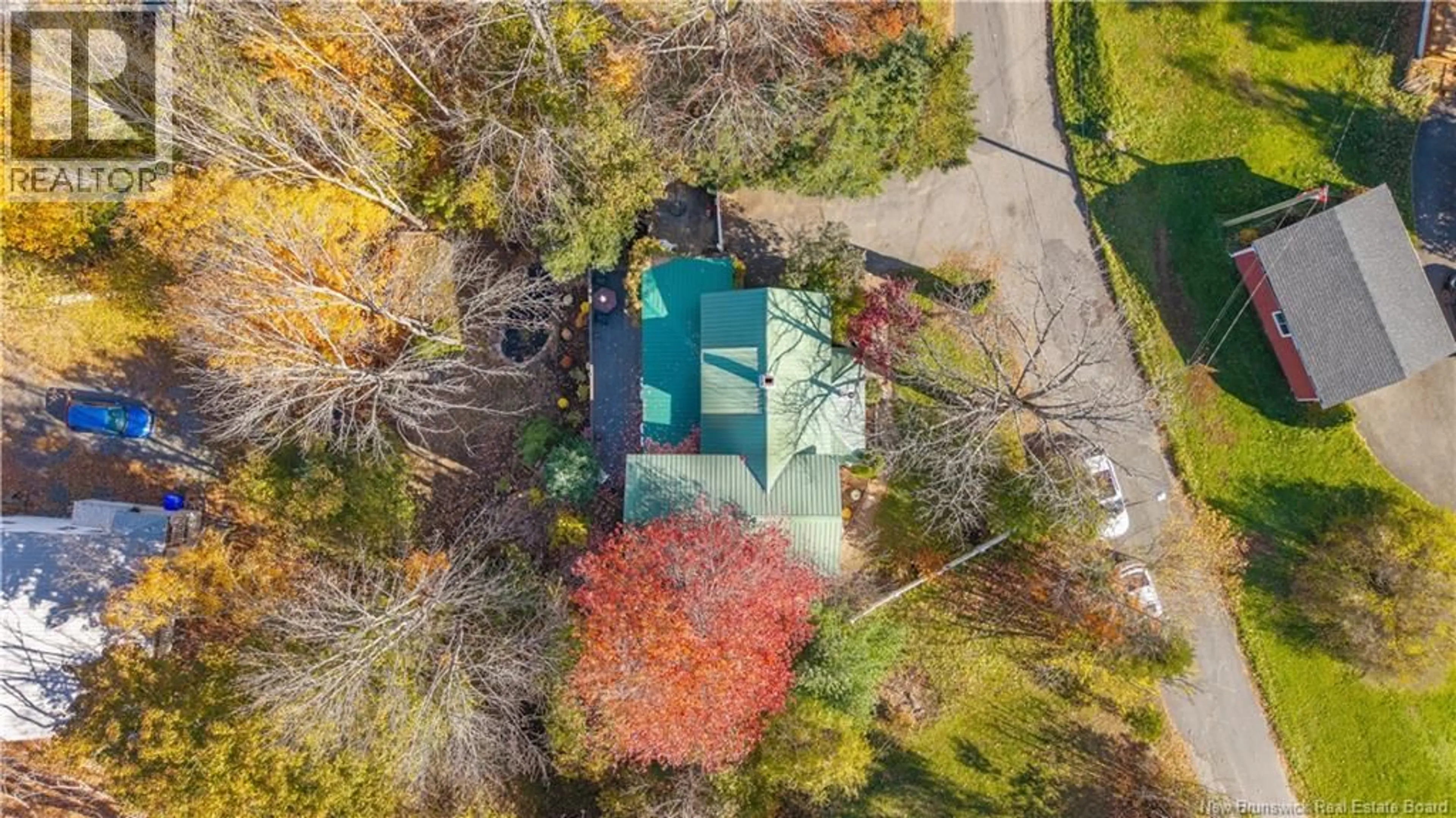 A pic from outside/outdoor area/front of a property/back of a property/a pic from drone, street for 5 HARTFOD LANE, St. Stephen New Brunswick E3L1P9