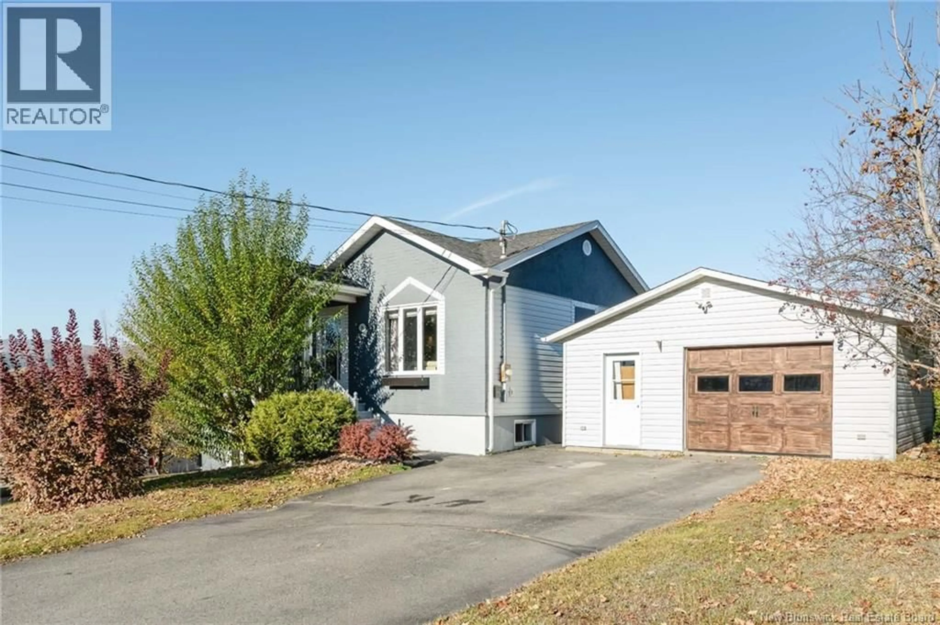 Home with vinyl exterior material, street for 4 MGR ROY AVE, Edmundston New Brunswick E3V4G4