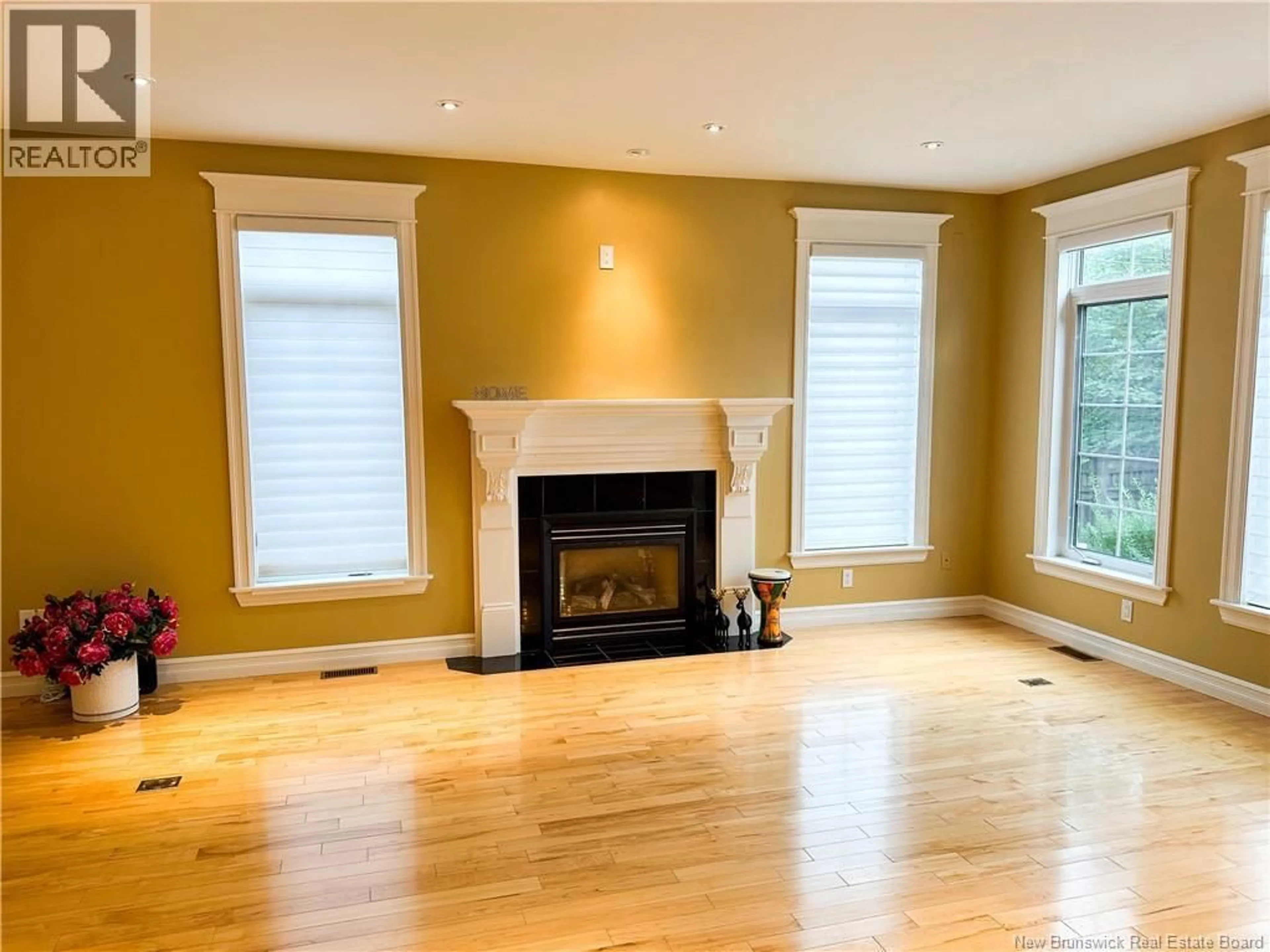 Living room with furniture, wood/laminate floor for 88 FOXWOOD DRIVE, Moncton New Brunswick E1G5H4
