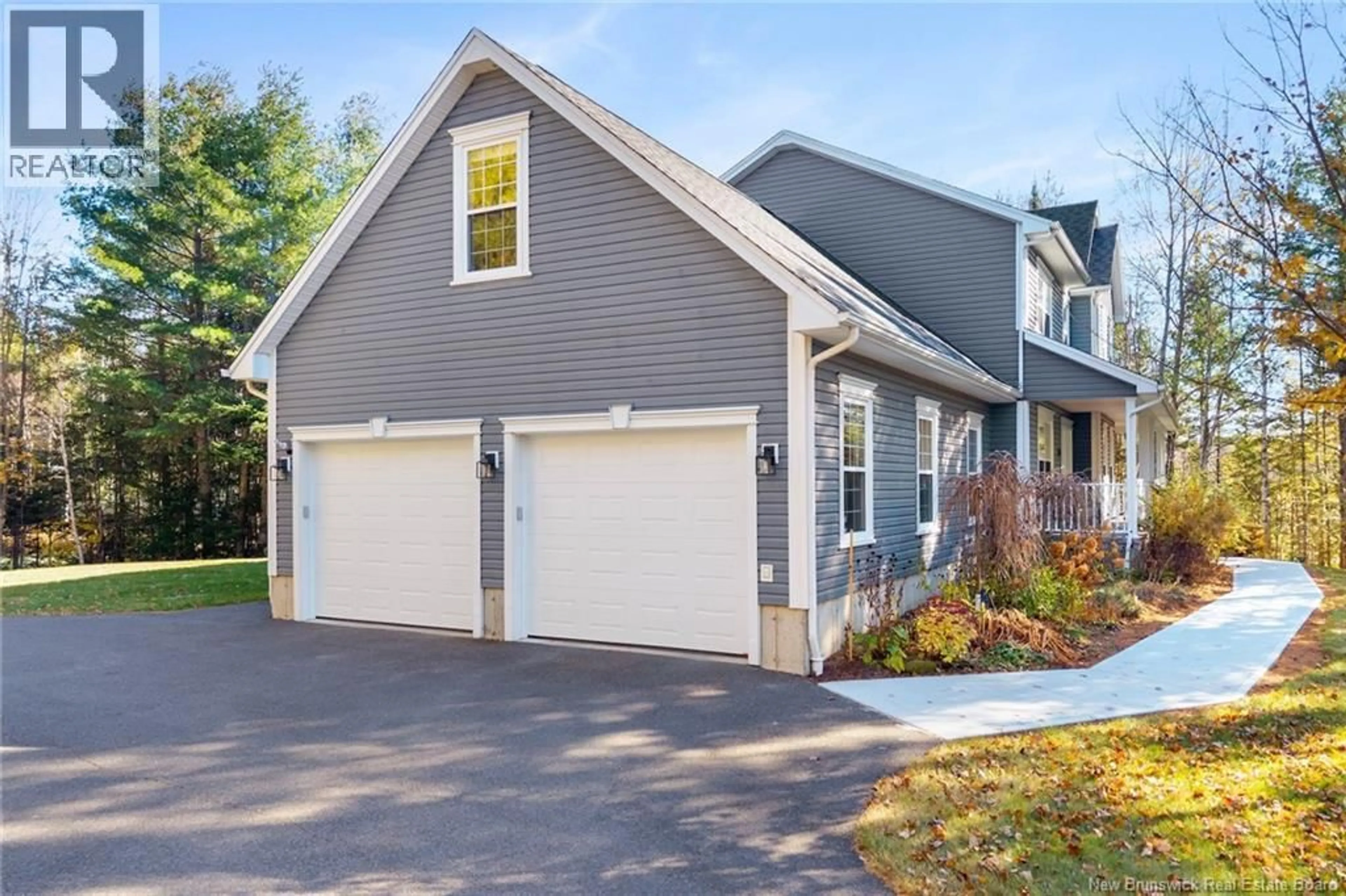 Home with vinyl exterior material, street for 18 PELICAN COURT, Hanwell New Brunswick E3E2L8
