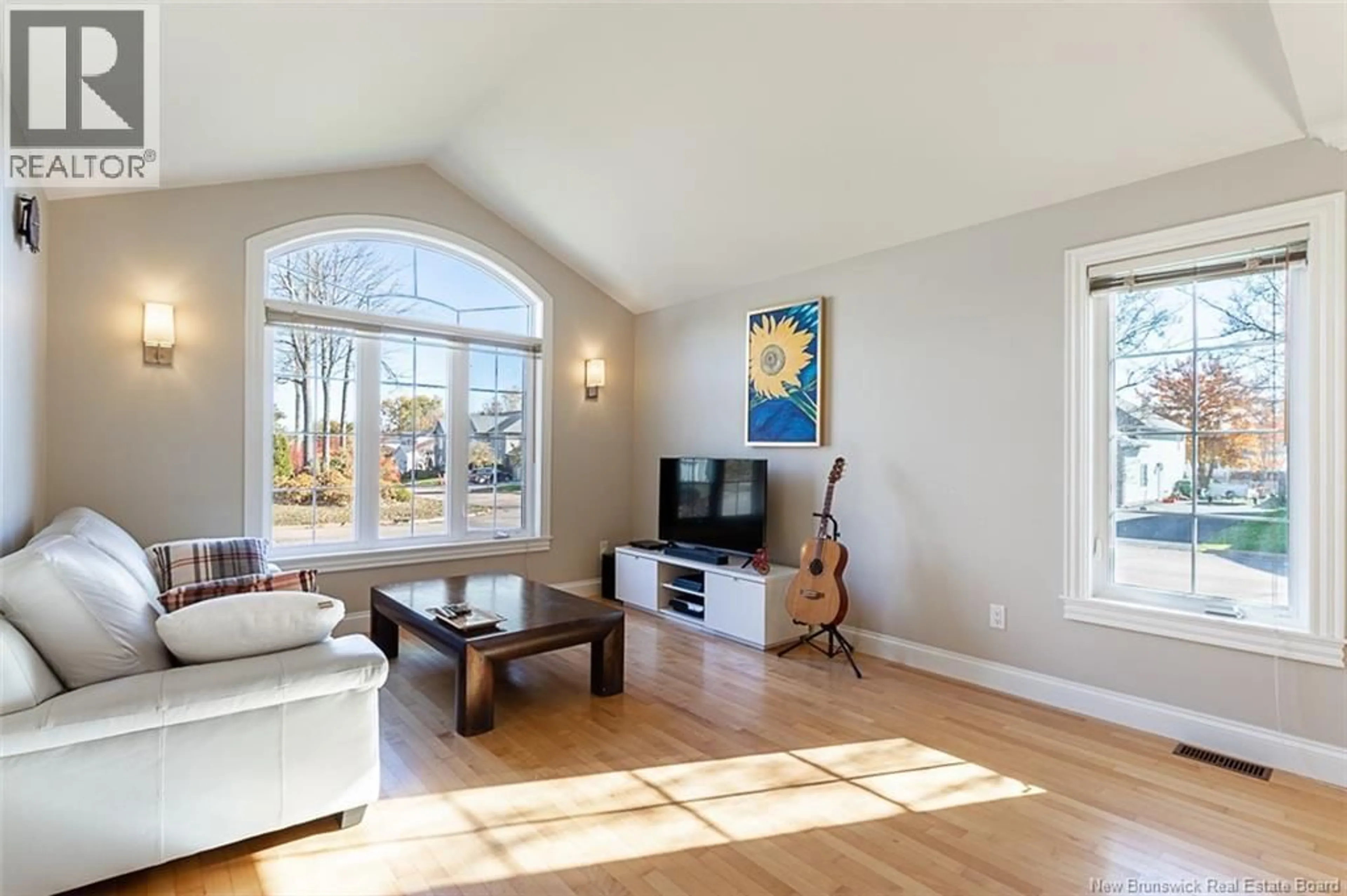 Living room with furniture, wood/laminate floor for 6 WILLOWDALE COURT, Moncton New Brunswick E1G3V9