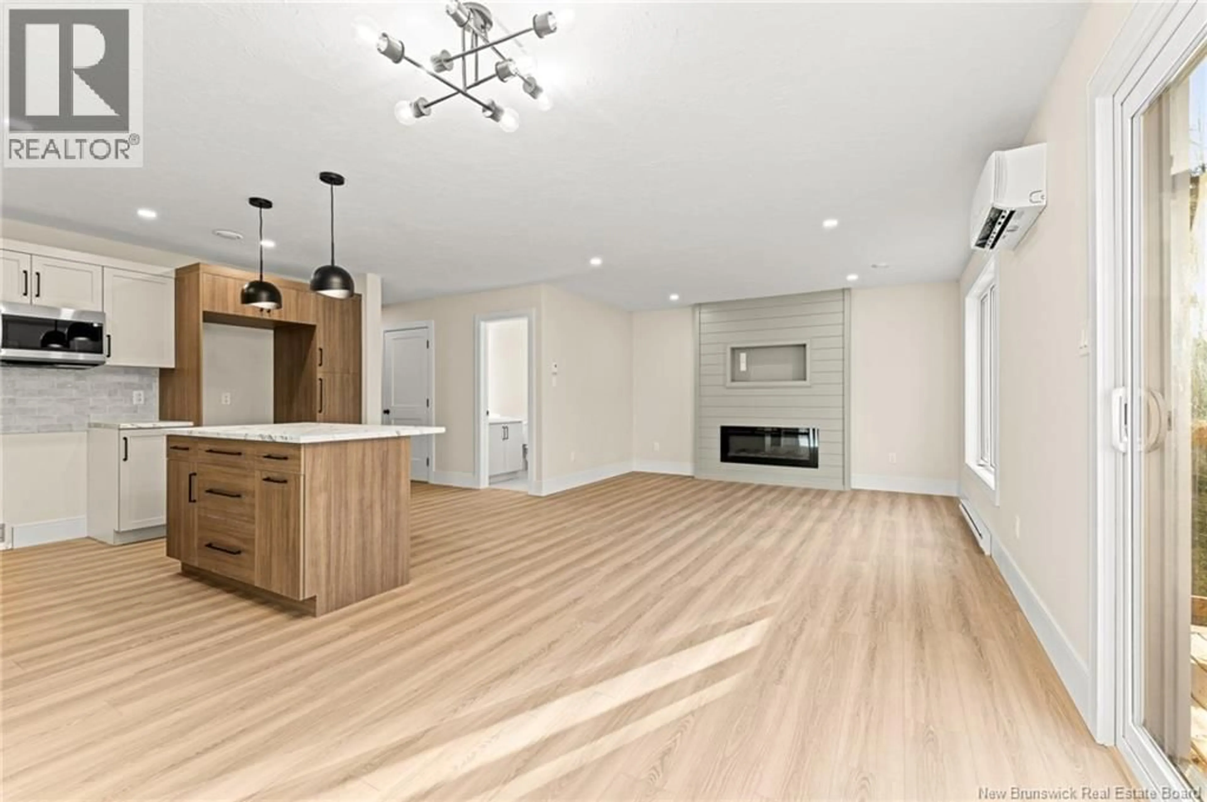 Open concept kitchen, wood/laminate floor for 341 LADY RUSSELL STREET, Moncton New Brunswick E1E0L9