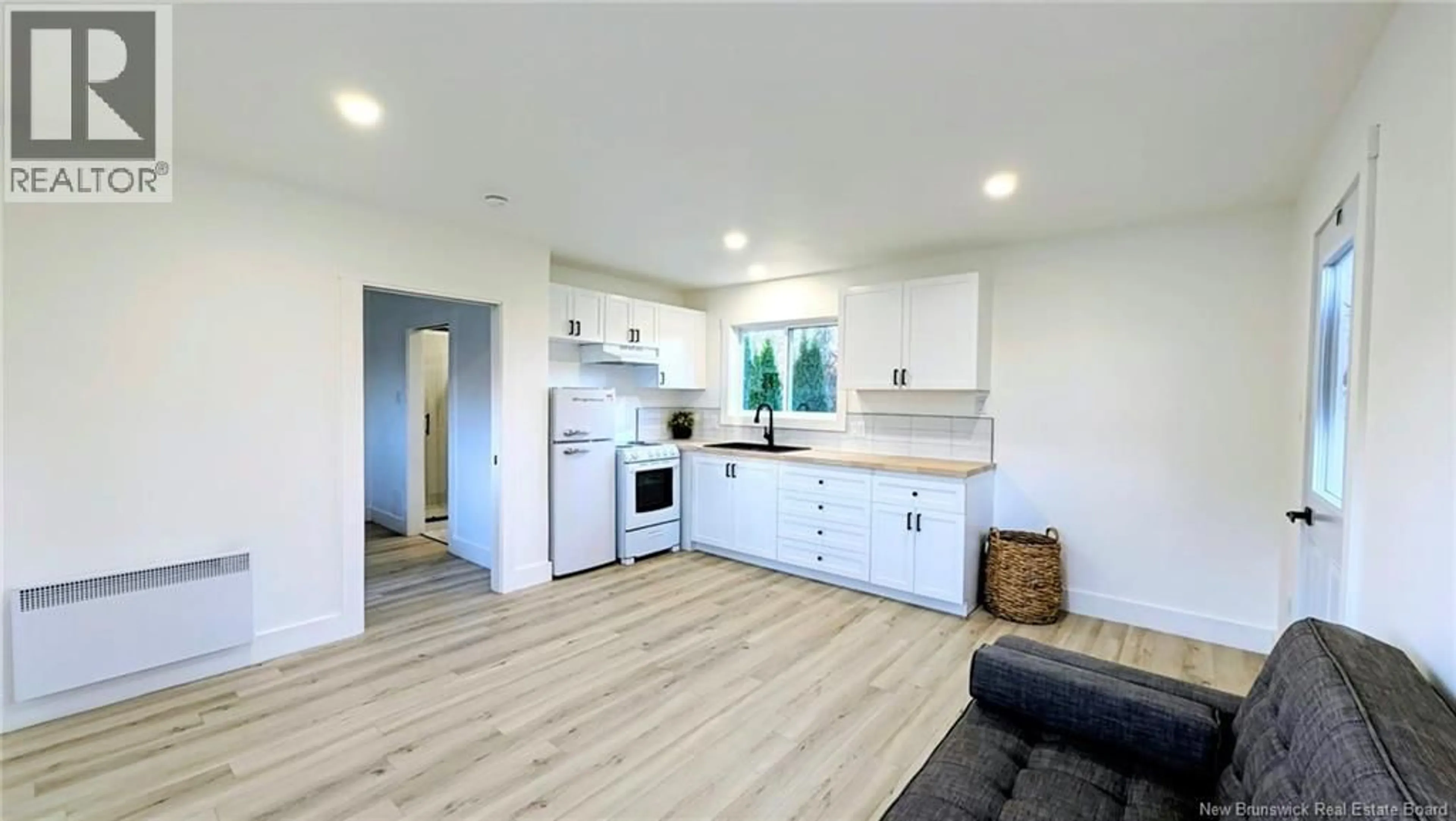 Open concept kitchen, wood/laminate floor for 229 POPLAR, Beresford New Brunswick E8K1E5