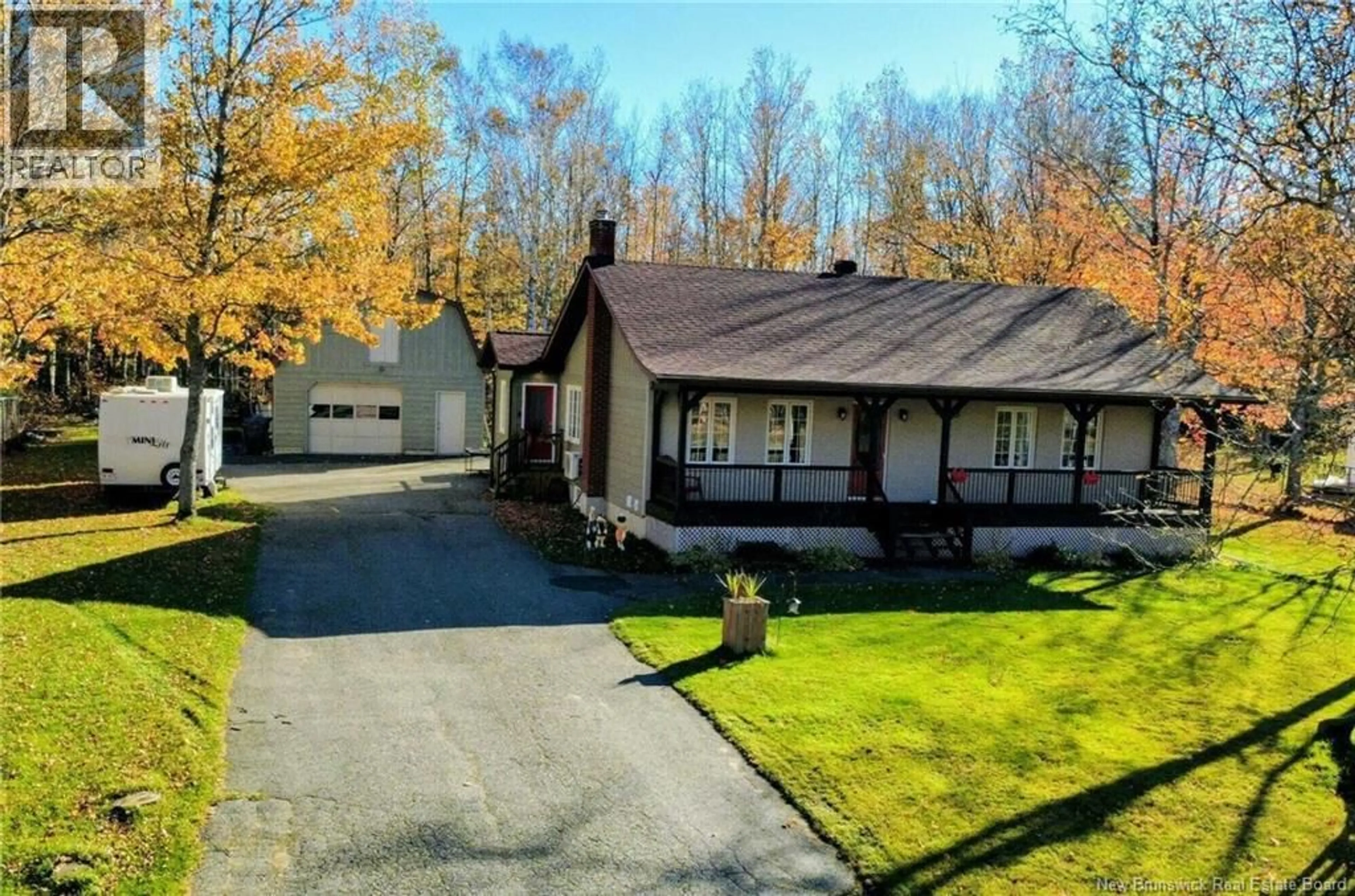 A pic from outside/outdoor area/front of a property/back of a property/a pic from drone, street for 258 RUE DES BOIS FRANCS, Saint-Léolin New Brunswick E8N2R1