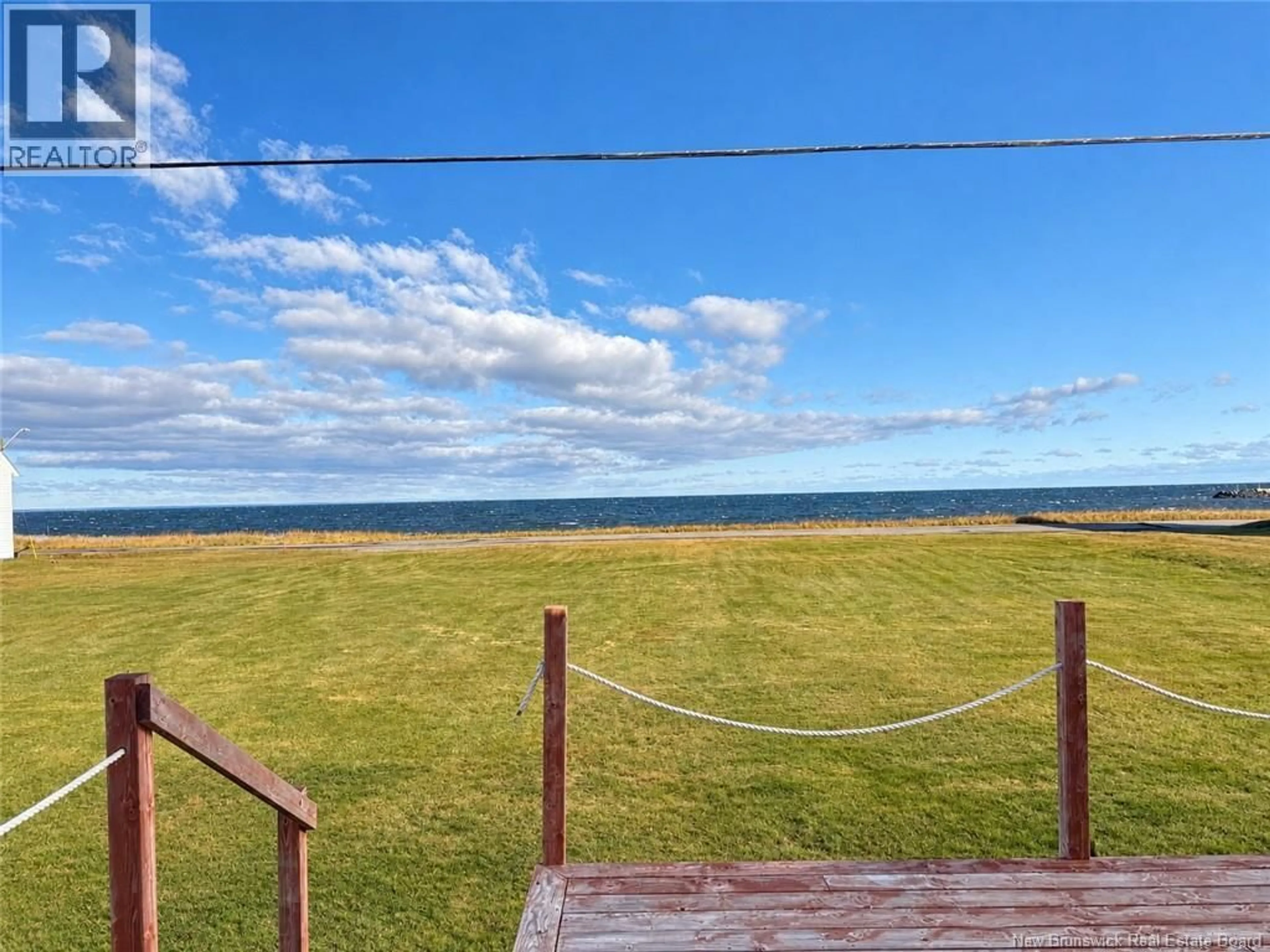 A pic from outside/outdoor area/front of a property/back of a property/a pic from drone, water/lake/river/ocean view for 180 ESCUMINAC POINT ROAD, Escuminac New Brunswick E9A1V7