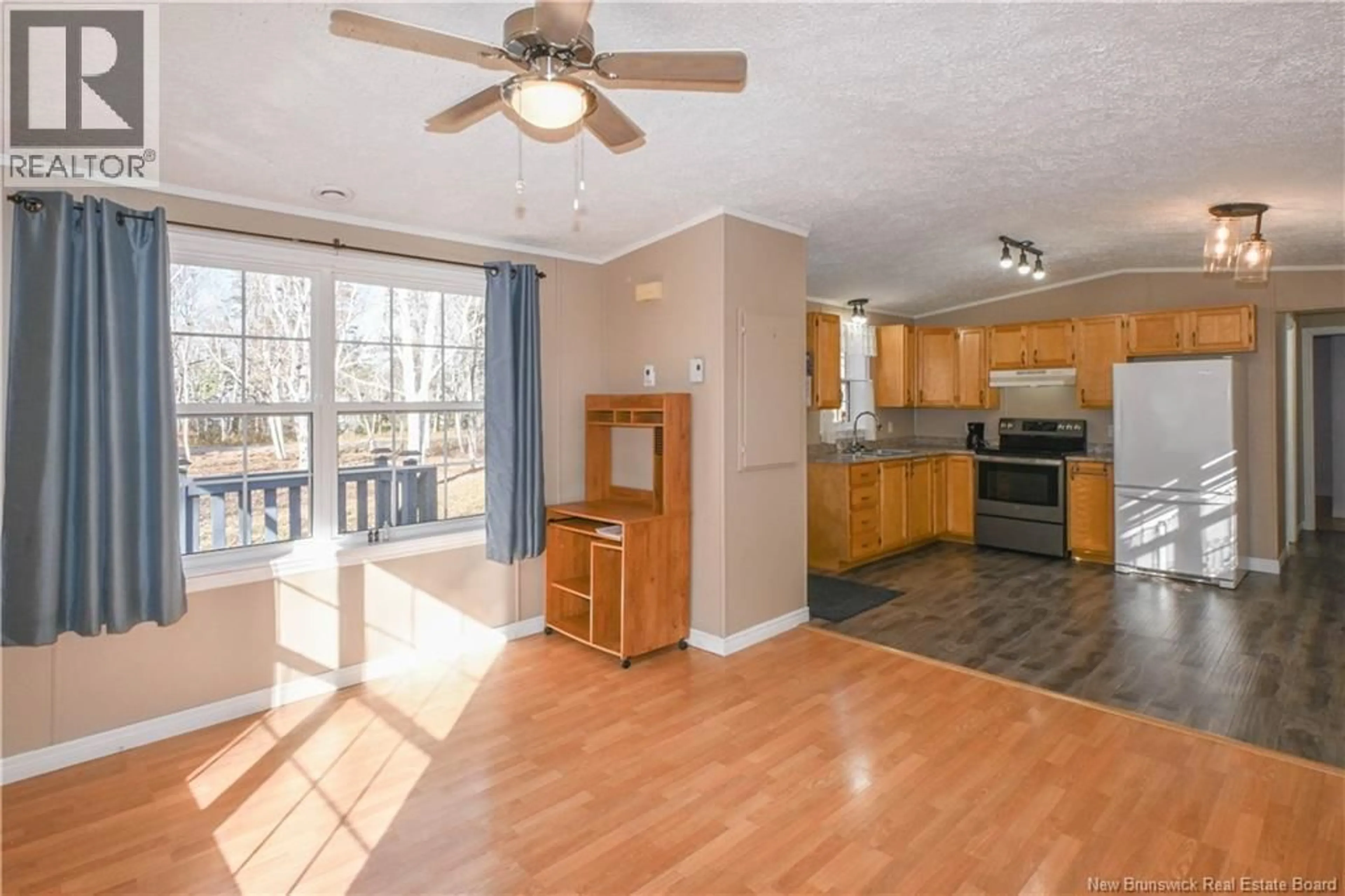 Open concept kitchen, wood/laminate floor for 6 SAINT-PIERRE STREET, Grande-Anse New Brunswick E8N1H4