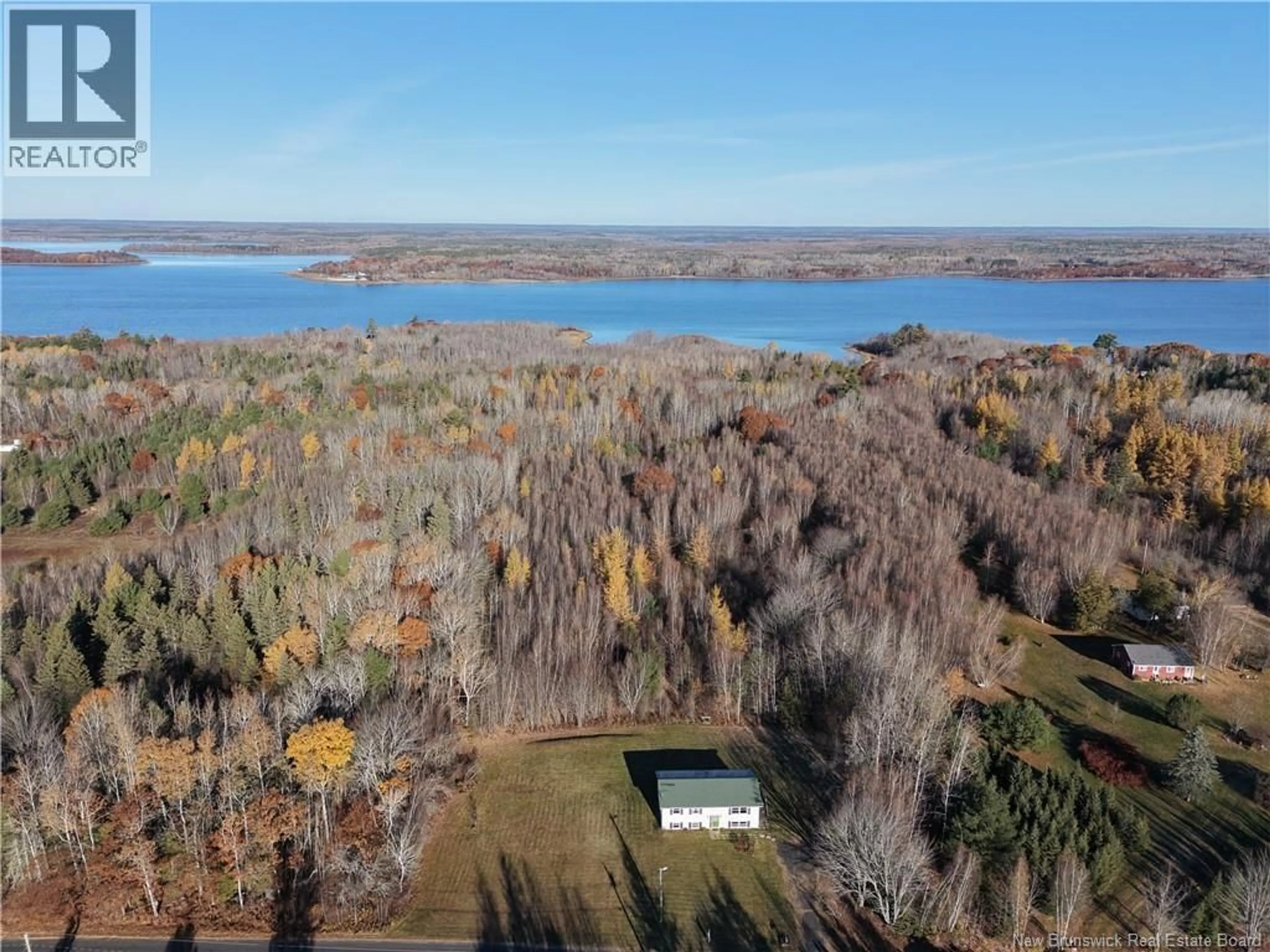 A pic from outside/outdoor area/front of a property/back of a property/a pic from drone, water/lake/river/ocean view for 12 COX POINT ROAD, Cumberland Bay New Brunswick E3B5G4