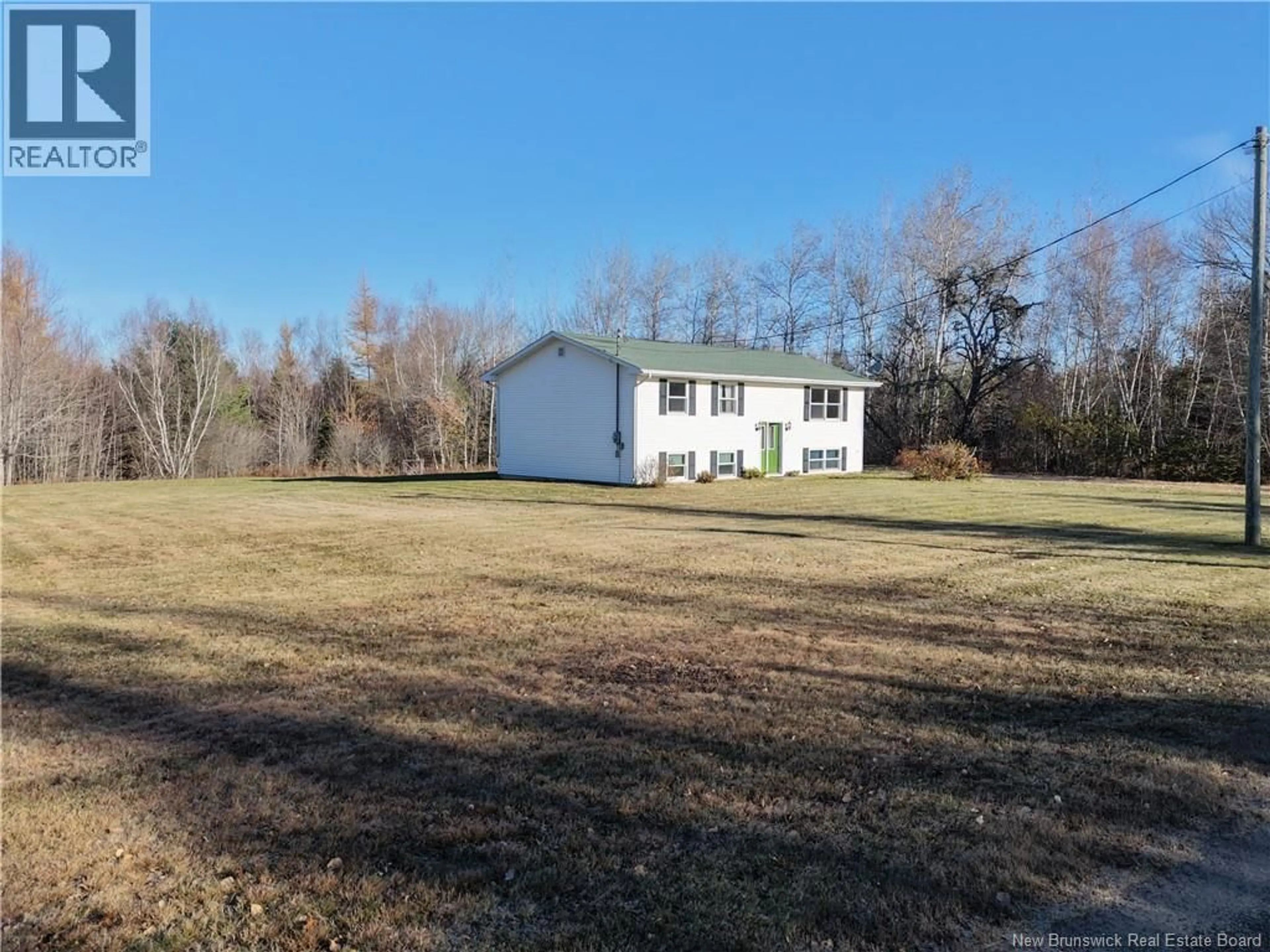 A pic from outside/outdoor area/front of a property/back of a property/a pic from drone, unknown for 12 COX POINT ROAD, Cumberland Bay New Brunswick E3B5G4
