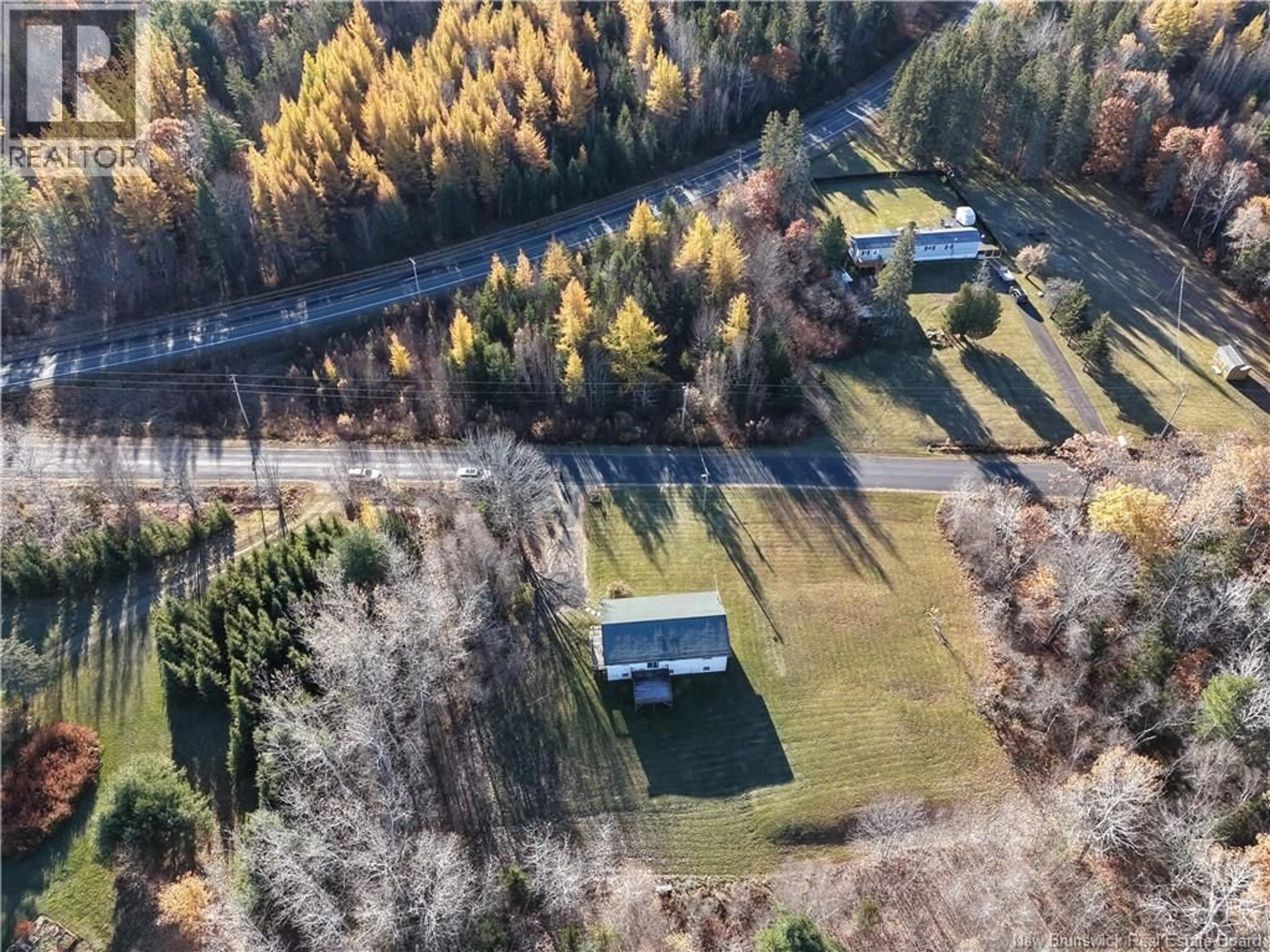 A pic from outside/outdoor area/front of a property/back of a property/a pic from drone, forest/trees view for 12 COX POINT ROAD, Cumberland Bay New Brunswick E3B5G4
