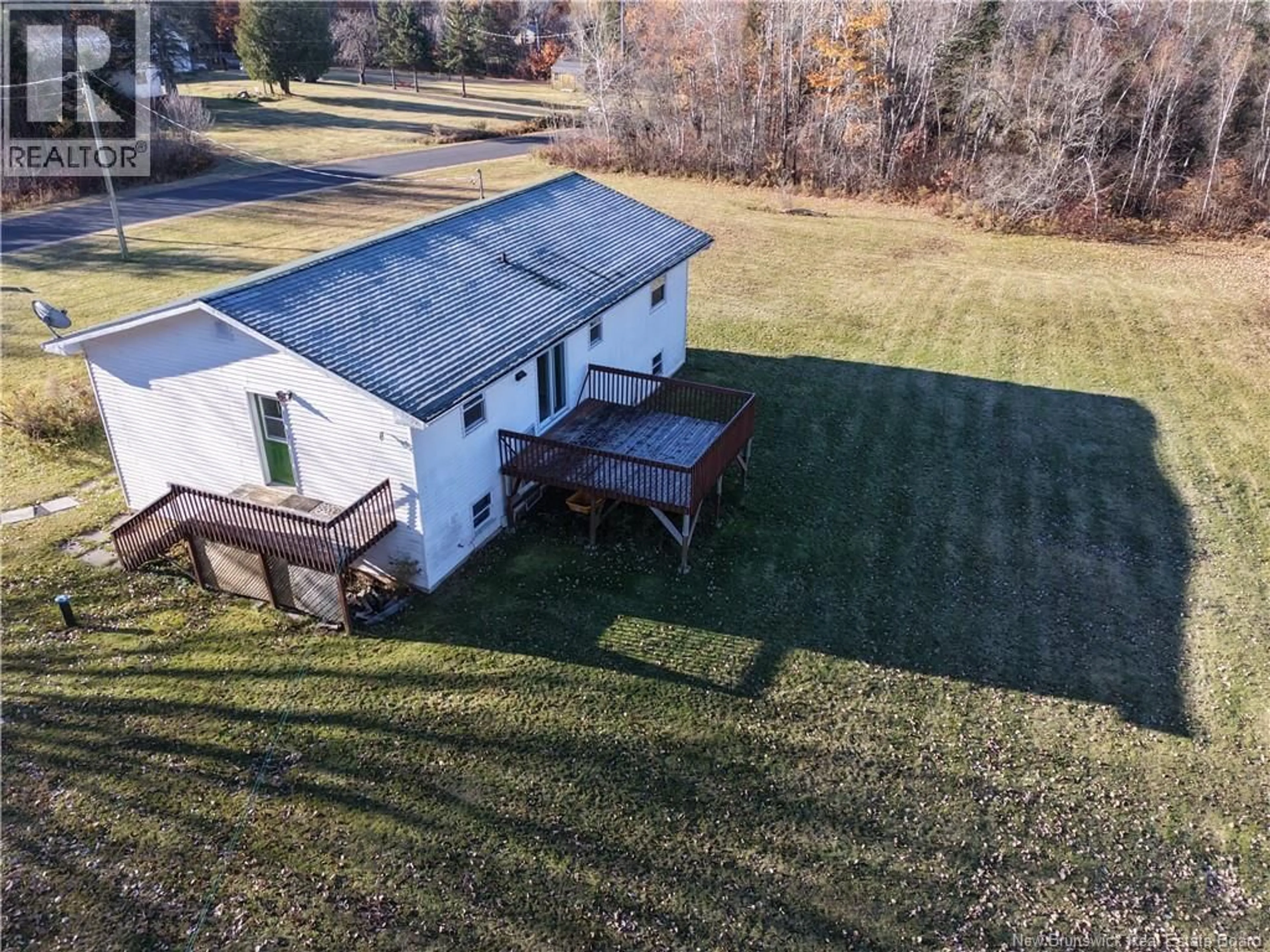 A pic from outside/outdoor area/front of a property/back of a property/a pic from drone, unknown for 12 COX POINT ROAD, Cumberland Bay New Brunswick E3B5G4