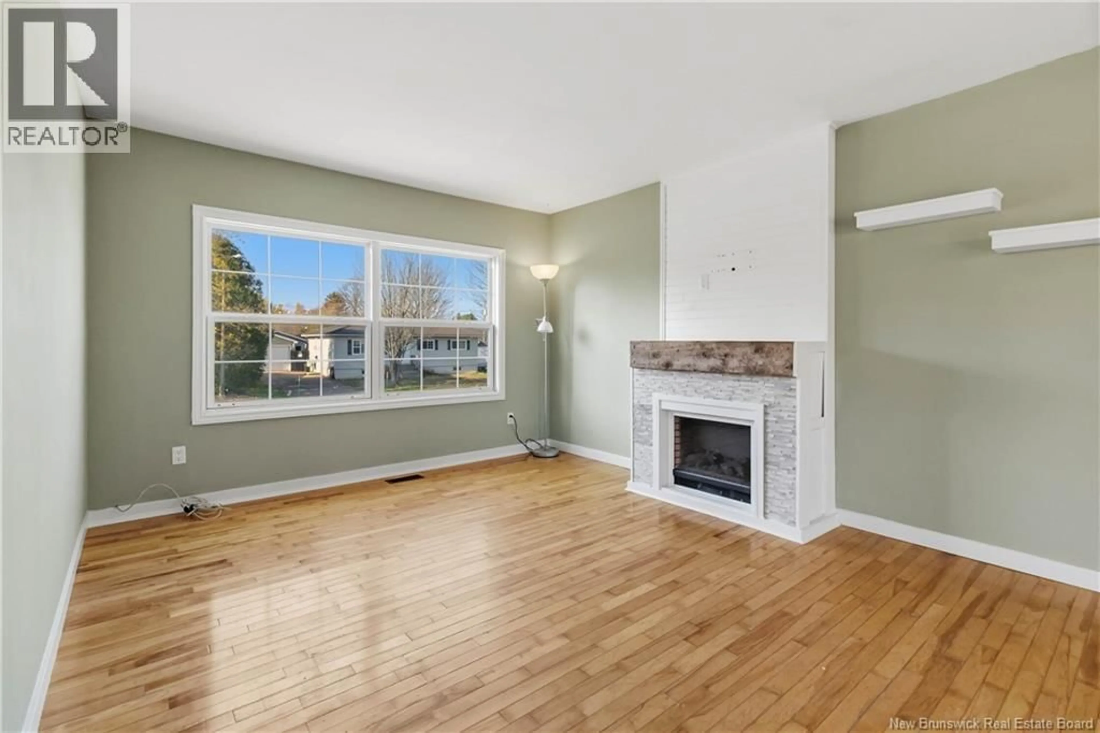 Living room with furniture, wood/laminate floor for 35 INVERNESS CRESCENT, Riverview New Brunswick E1B3Z6
