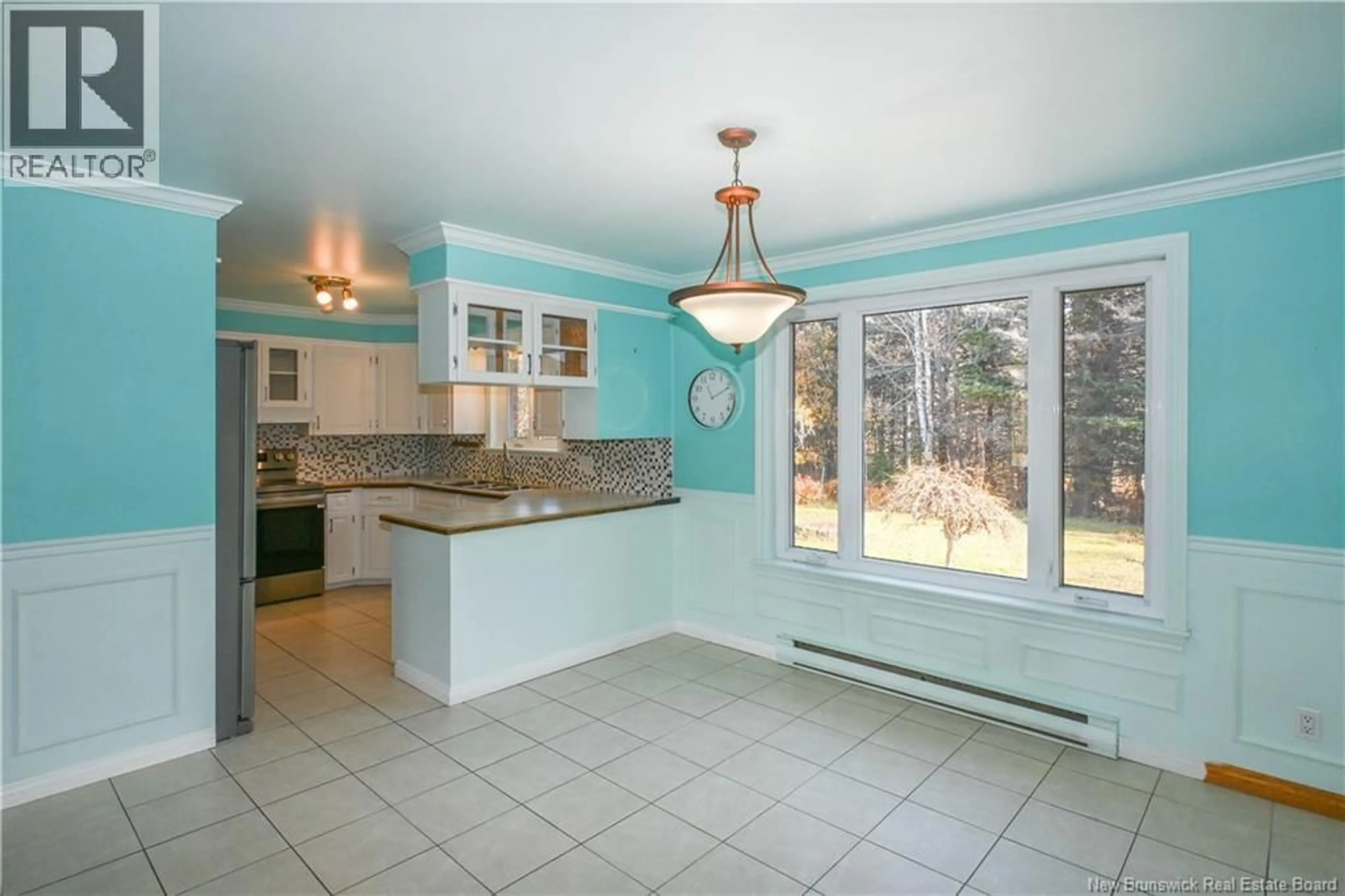 Open concept kitchen, ceramic/tile floor for 23 DES PATRIOTES STREET, Caraquet New Brunswick E1W1B6