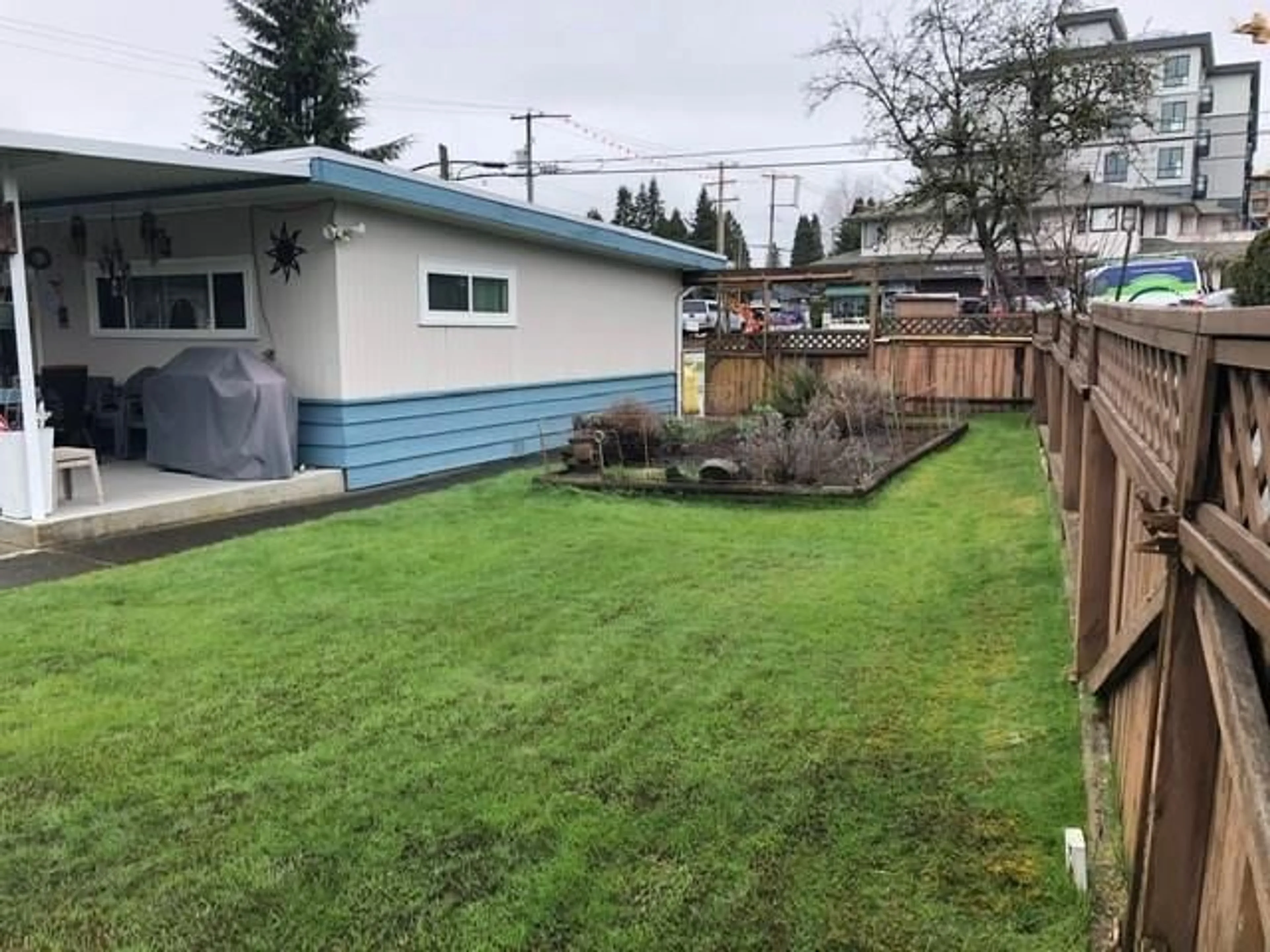 Frontside or backside of a home, the fenced backyard for 650 CLARKE ROAD, Coquitlam British Columbia V3J3X6