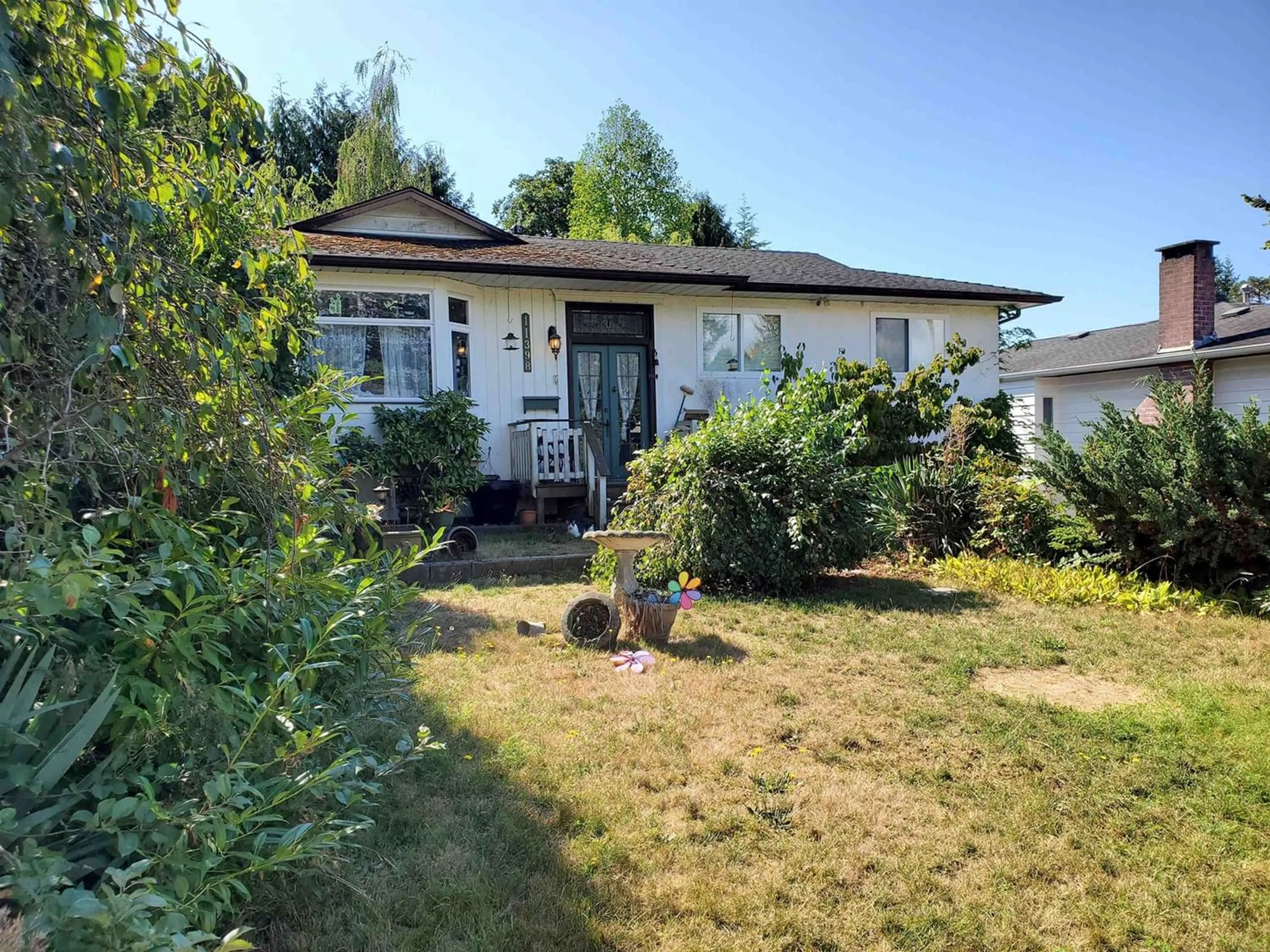 Frontside or backside of a home for 11398 88A AVENUE, Delta British Columbia V4C3E4