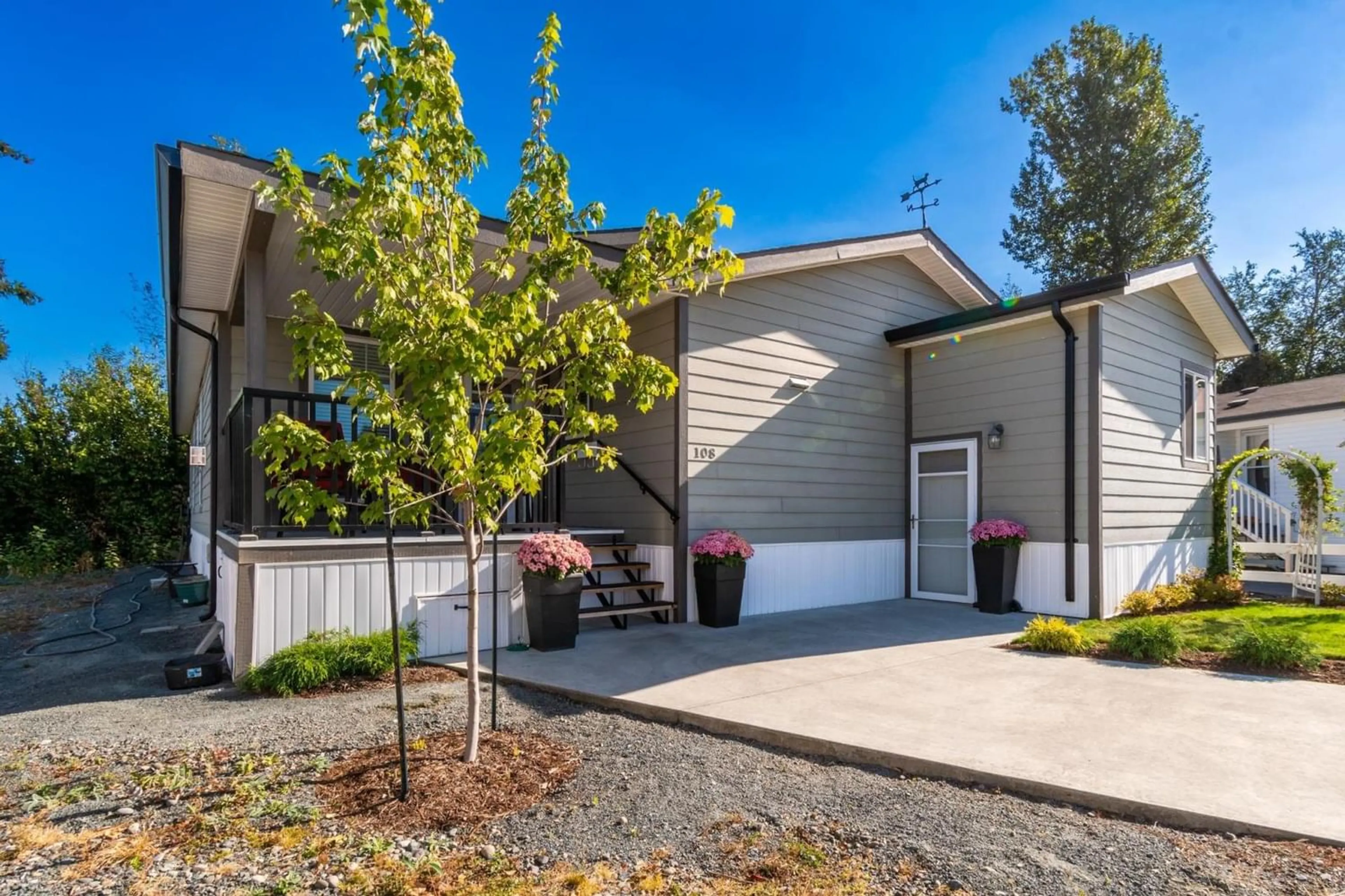 A pic from exterior of the house or condo, the fenced backyard for 108 6338 VEDDER ROAD, Chilliwack British Columbia V2R3R2