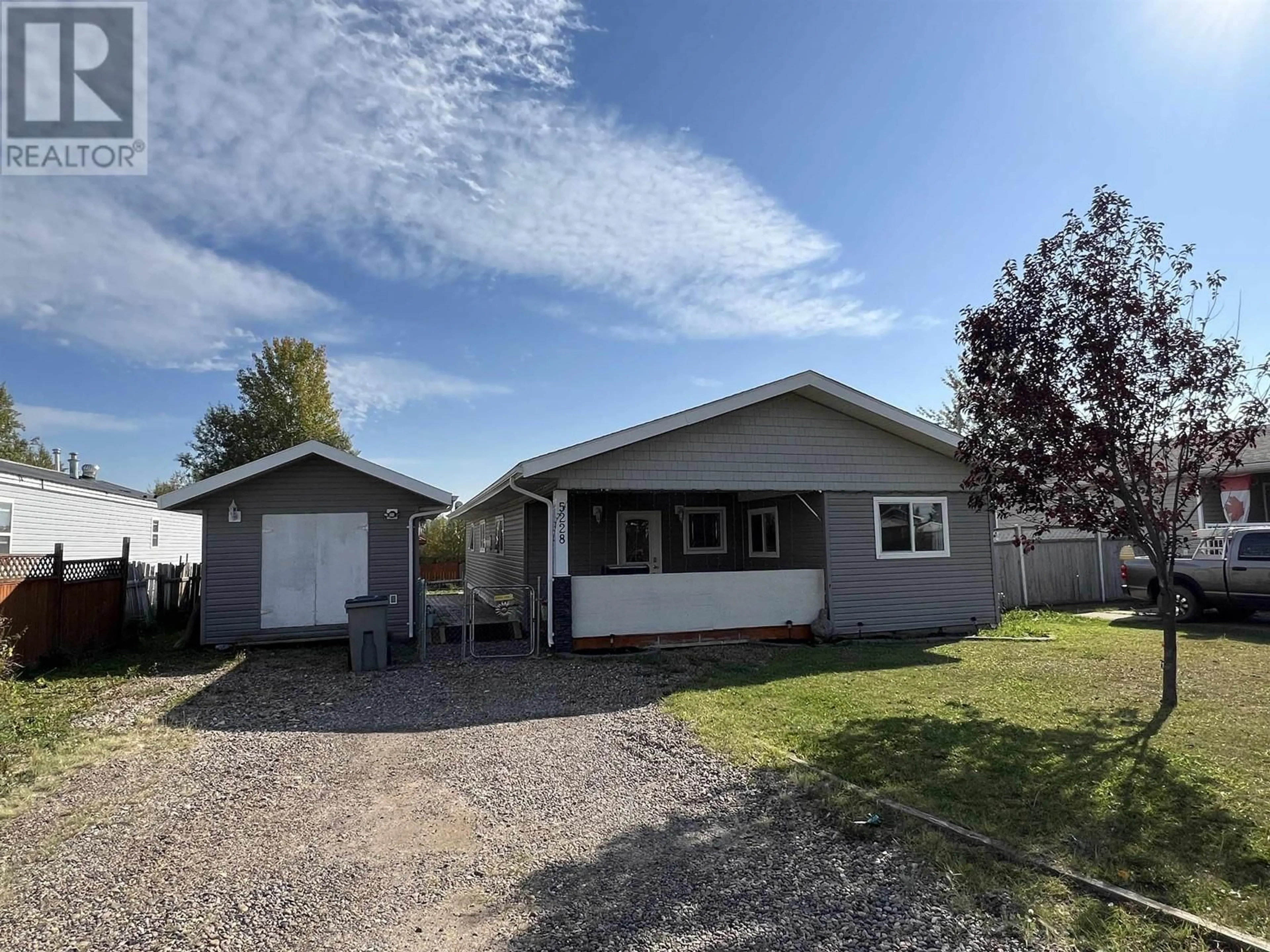 Home with vinyl exterior material, street for 5228 40 STREET, Fort Nelson British Columbia V0C1R0