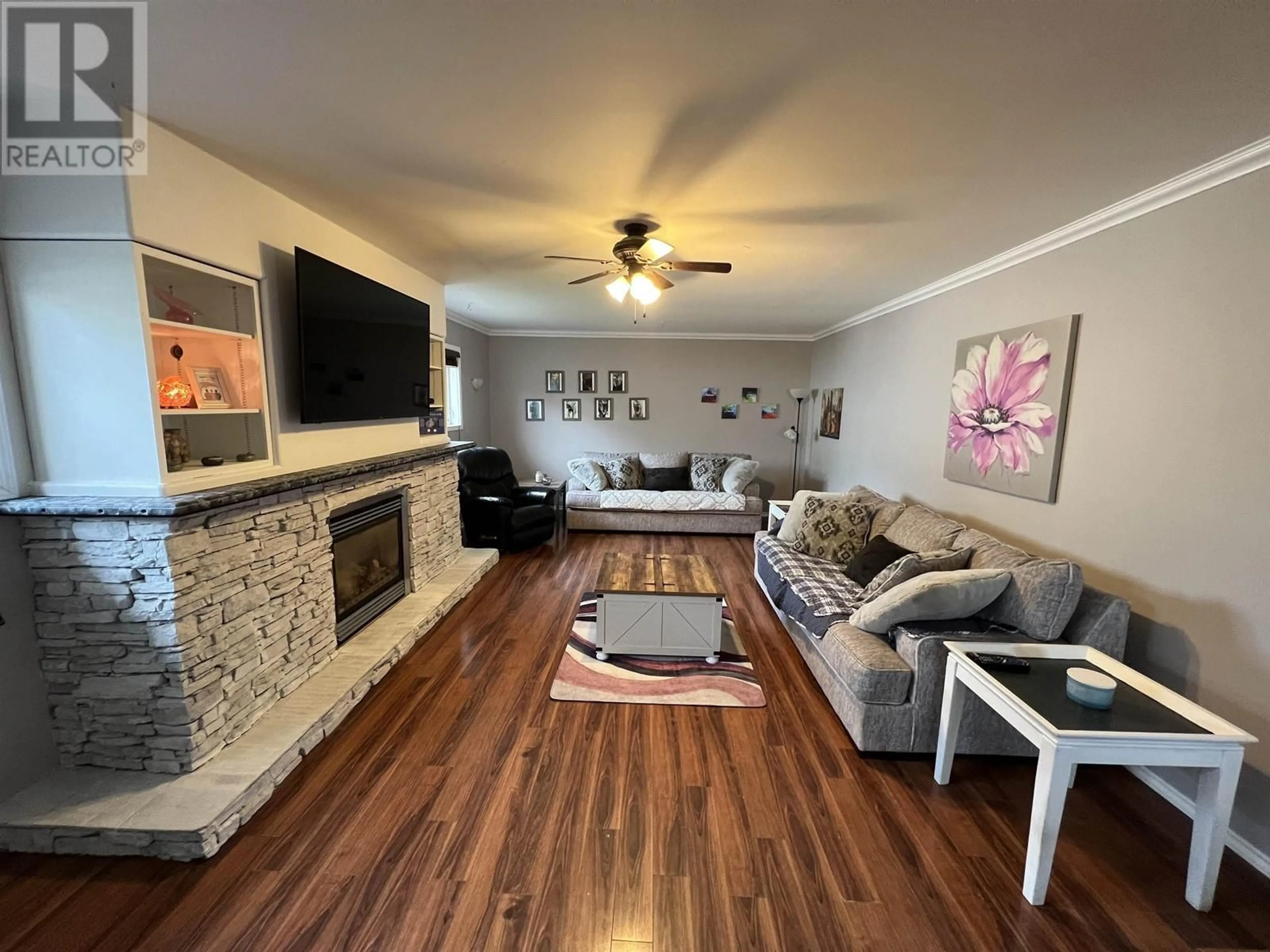 Living room with furniture, wood/laminate floor for 5228 40 STREET, Fort Nelson British Columbia V0C1R0