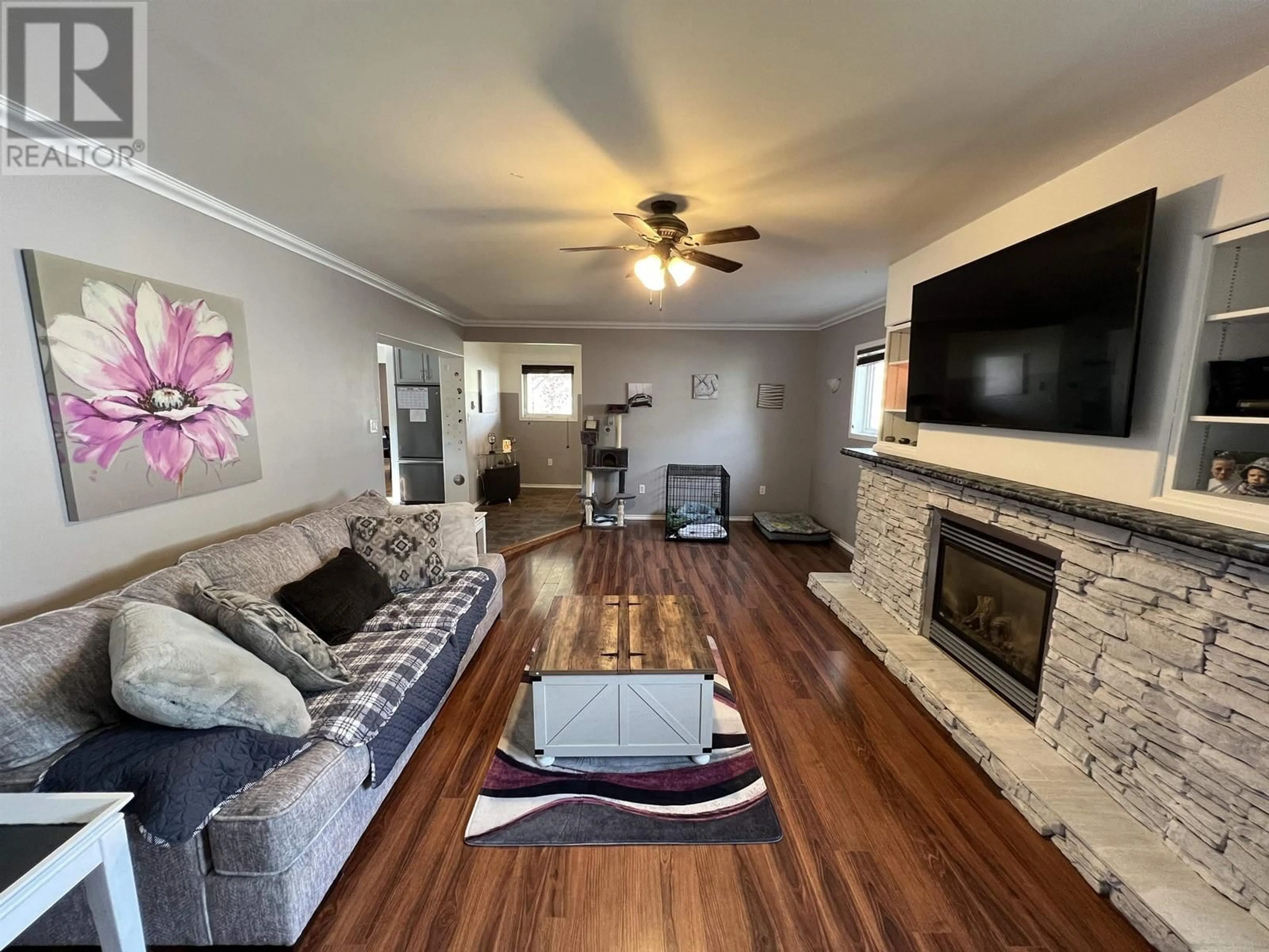 Living room with furniture, wood/laminate floor for 5228 40 STREET, Fort Nelson British Columbia V0C1R0