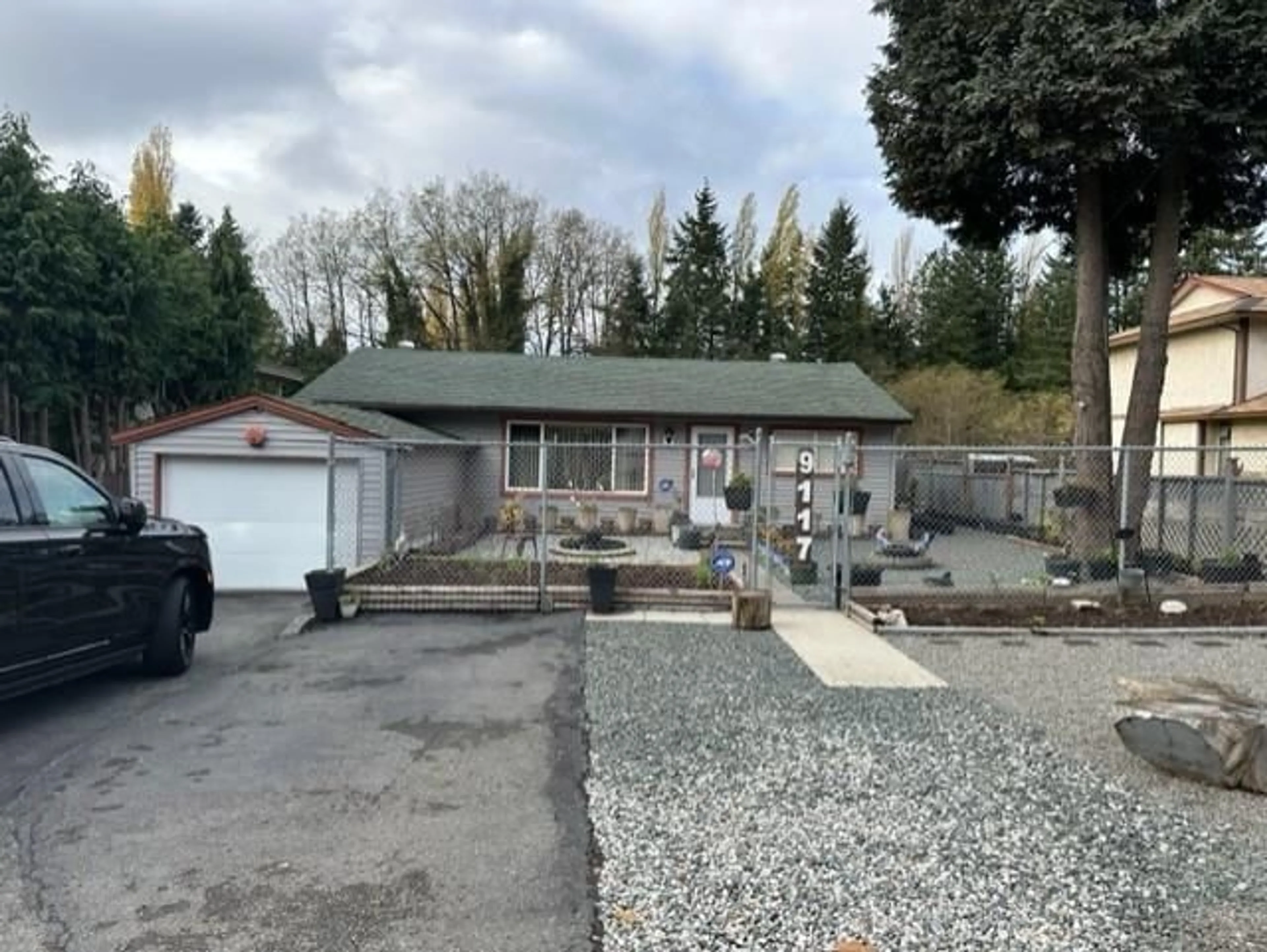 Frontside or backside of a home for 9117 149 STREET, Surrey British Columbia V3R3Z5