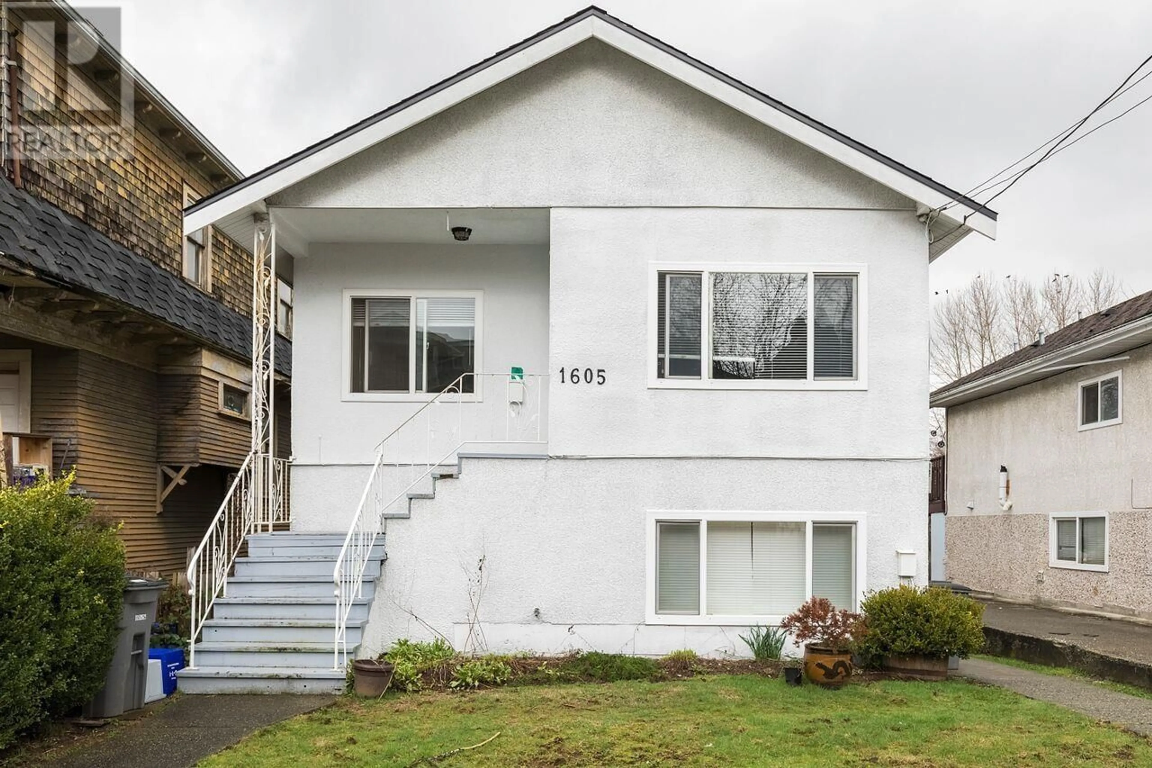 Home with vinyl exterior material, street for 1605 E 8TH AVENUE, Vancouver British Columbia V5N1T6