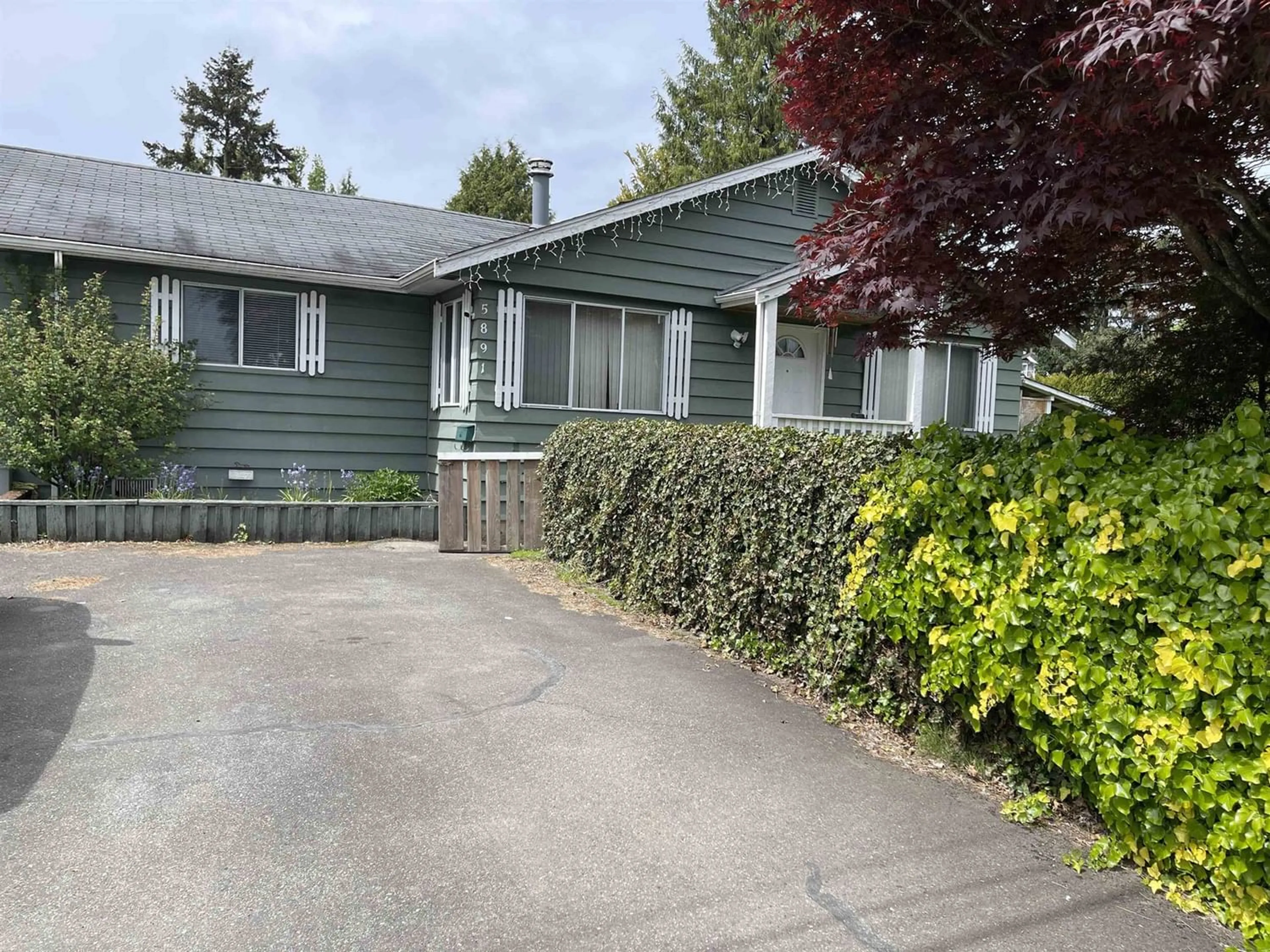 Frontside or backside of a home for 5891 173B STREET, Surrey British Columbia V3S4A9