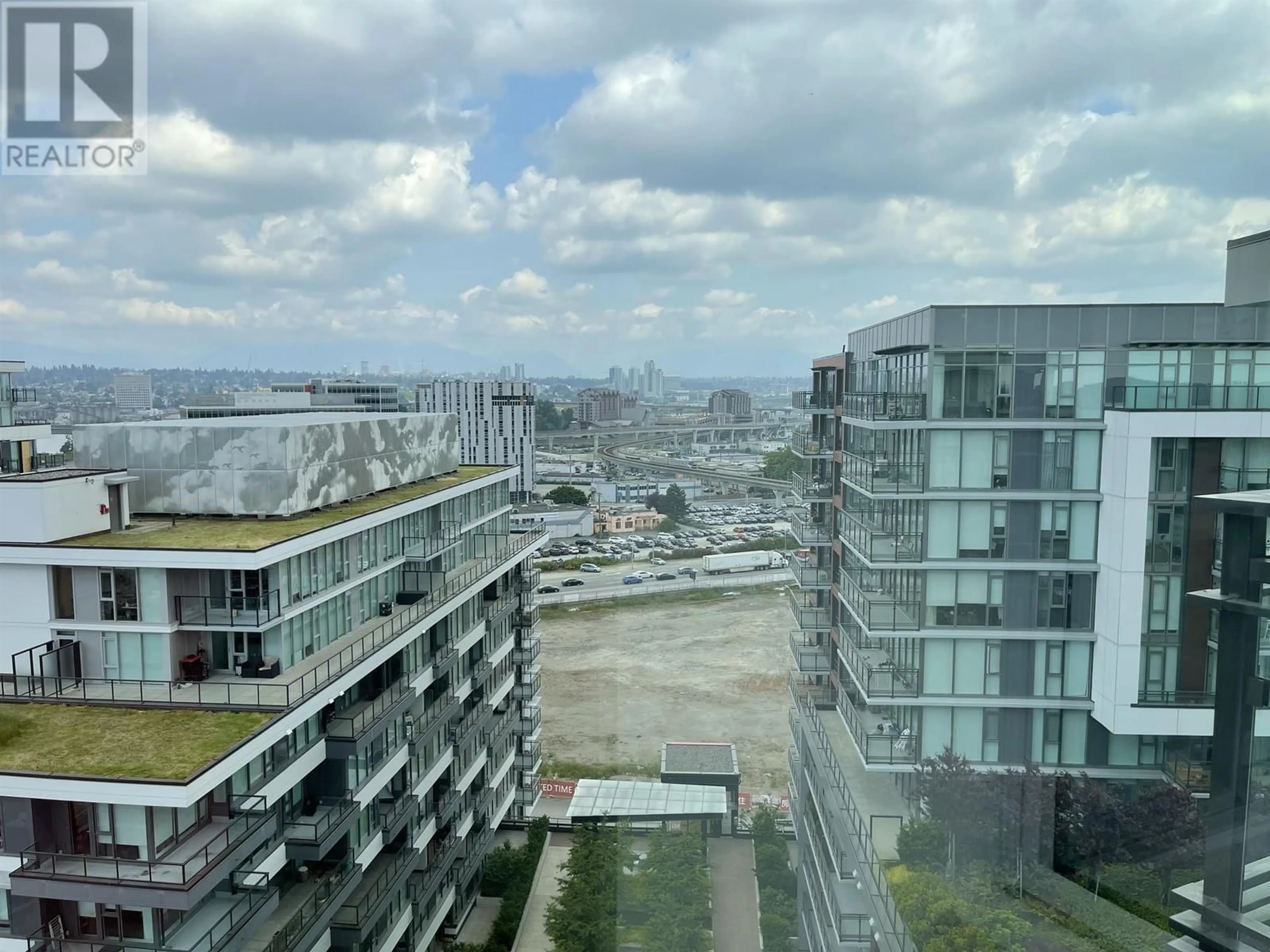 A pic from exterior of the house or condo, the view of city buildings for 1700 8199 CAPSTAN WAY, Vancouver British Columbia V6X0V1