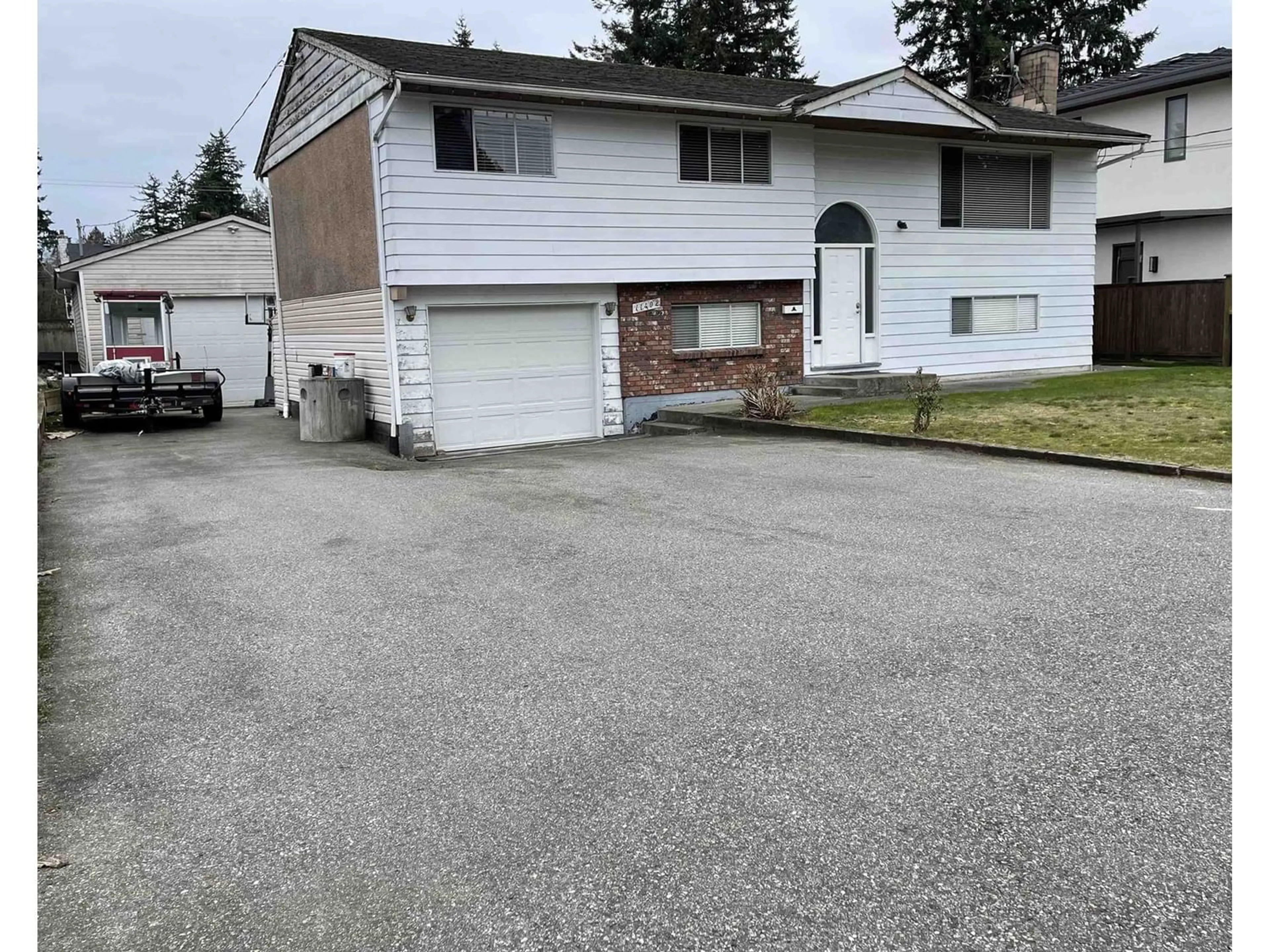 Frontside or backside of a home for 11402 72A AVENUE, Delta British Columbia V4C1A6