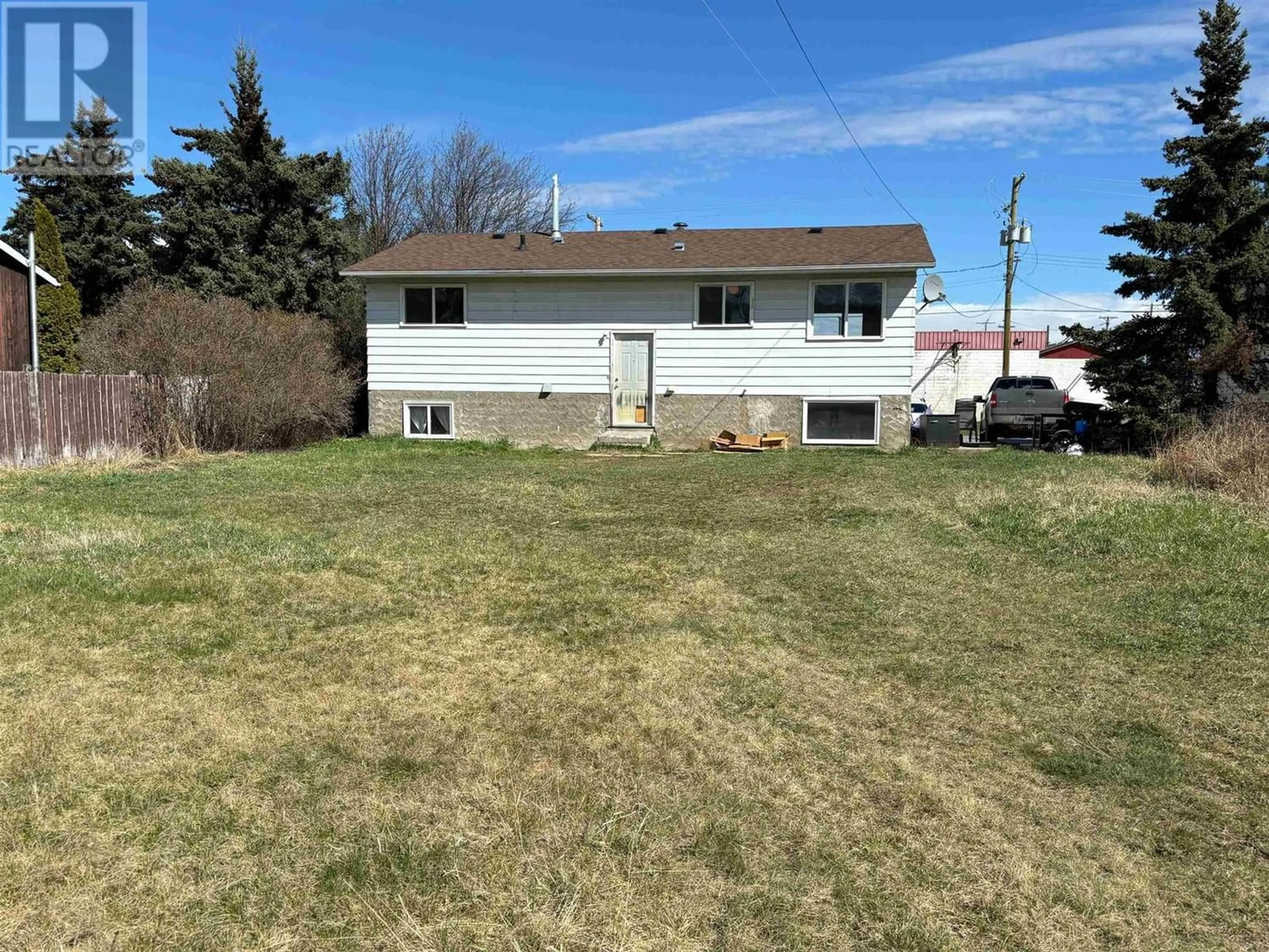 Frontside or backside of a home, the fenced backyard for 312 W 2ND STREET, Vanderhoof British Columbia V0J3A0