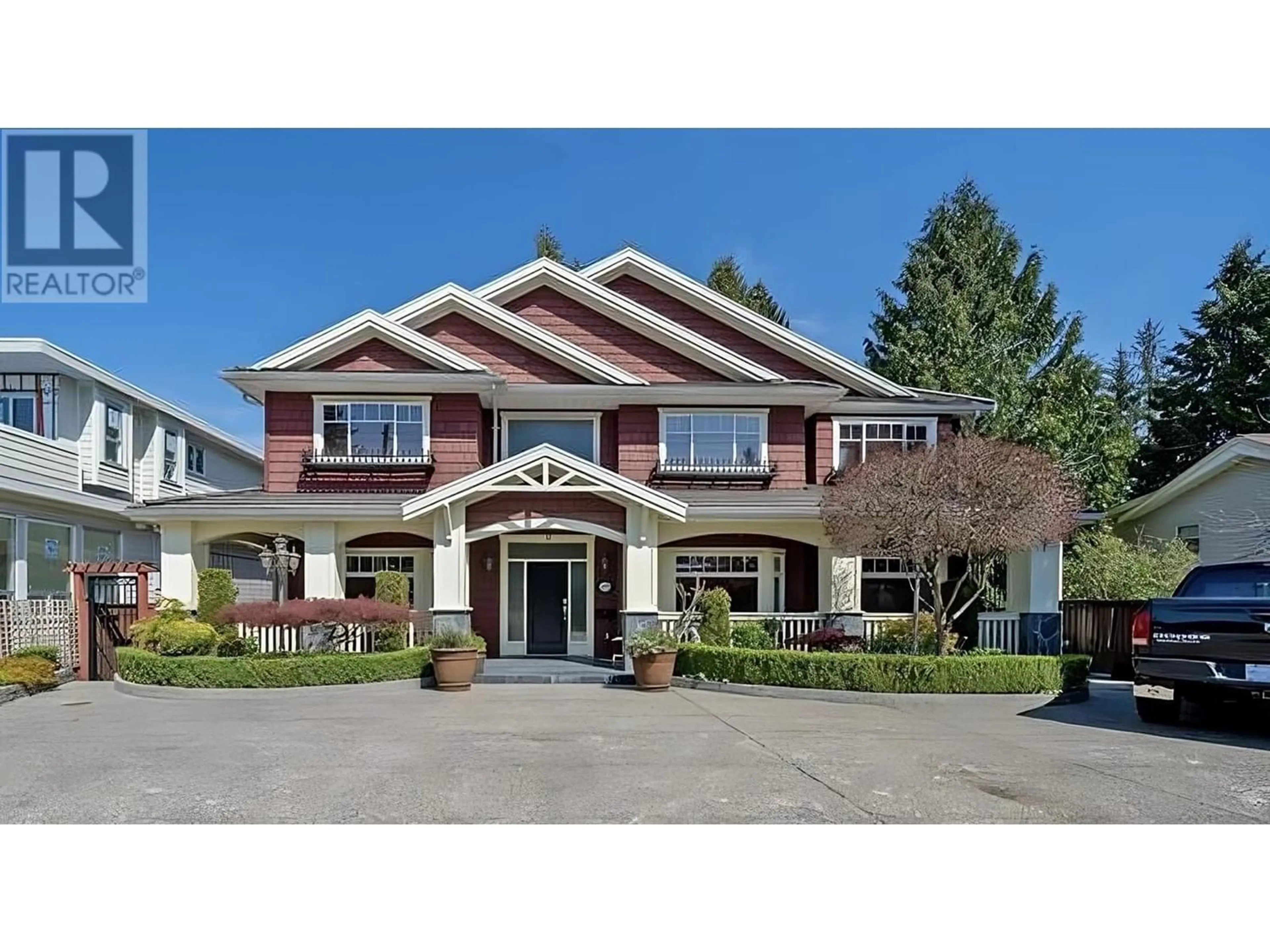 Frontside or backside of a home for 1033 COMO LAKE AVENUE, Coquitlam British Columbia V3J3N7