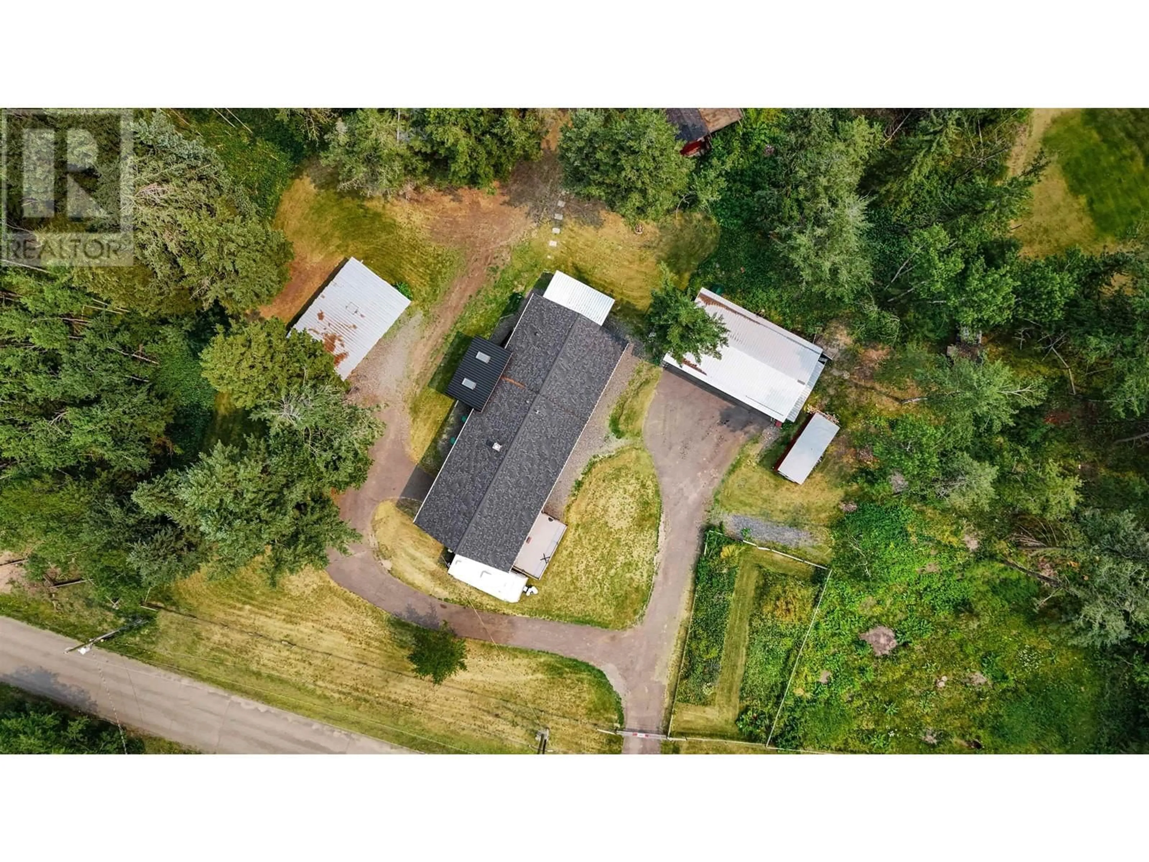 A pic from outside/outdoor area/front of a property/back of a property/a pic from drone, unknown for 4719 CARIBOO DRIVE, 108 Mile Ranch British Columbia V0K2Z0