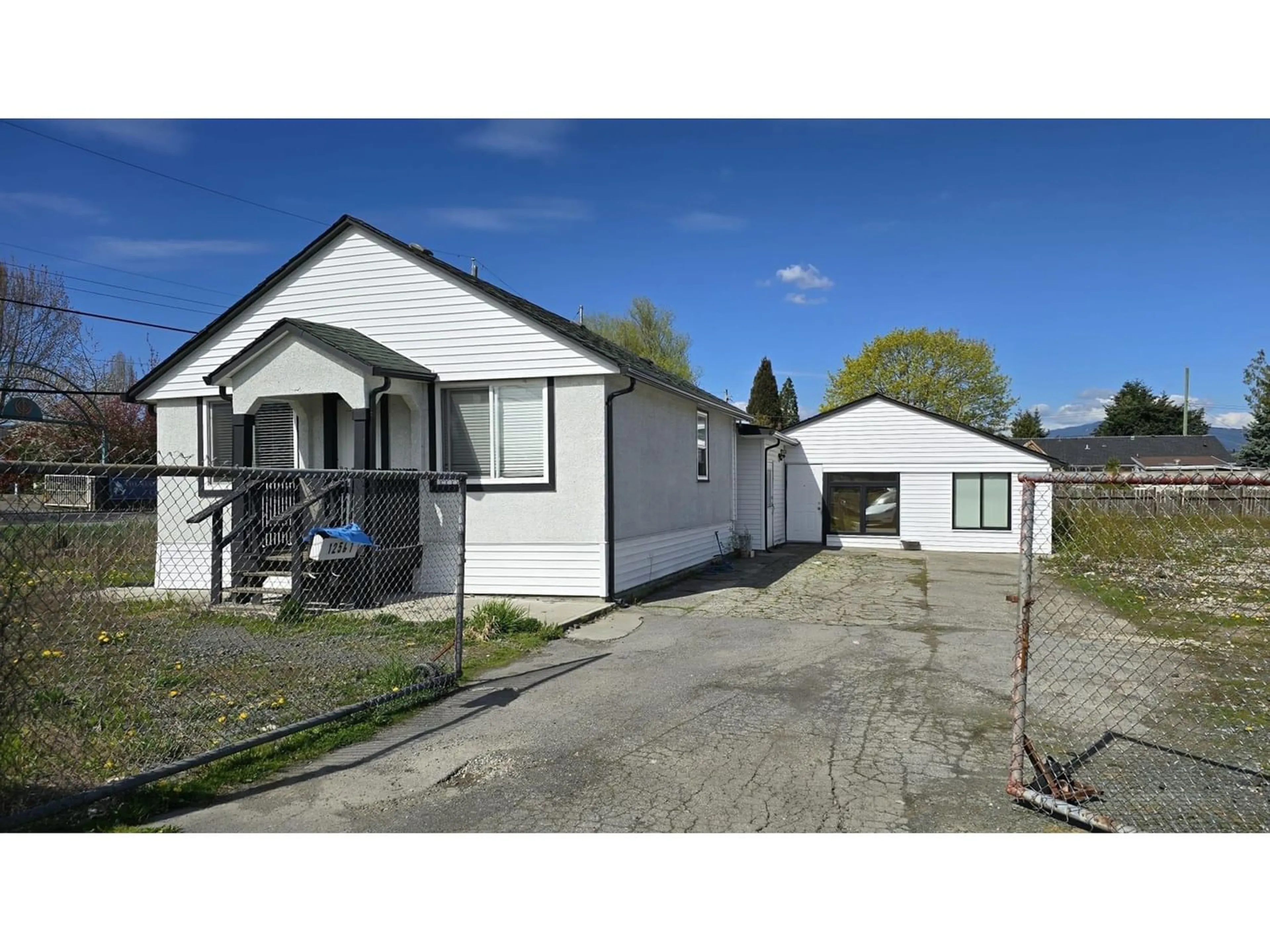 Frontside or backside of a home for 12561 112A AVENUE, Surrey British Columbia V3V3L3