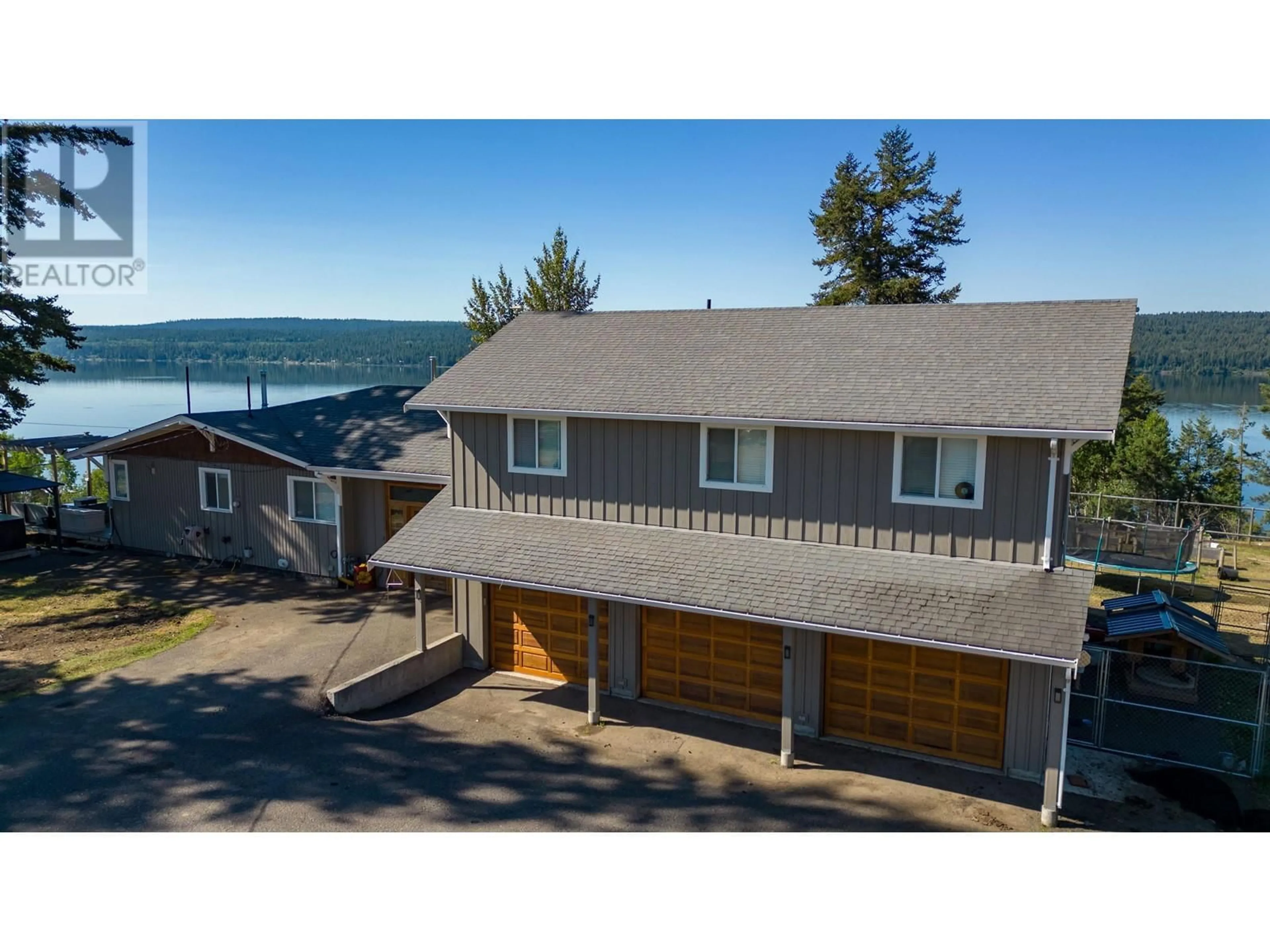 A pic from outside/outdoor area/front of a property/back of a property/a pic from drone, water/lake/river/ocean view for 3920 TROUT DRIVE, Lac La Hache British Columbia V0K1T0