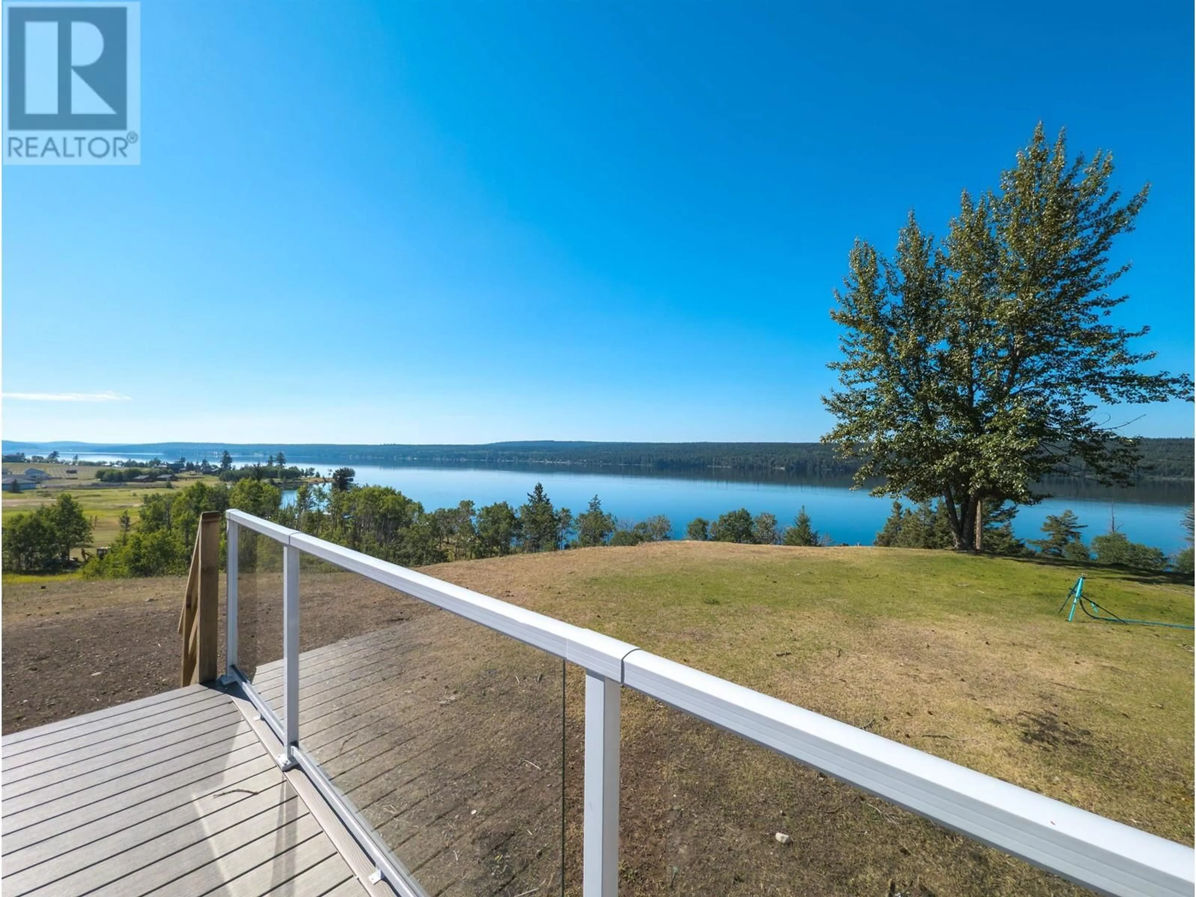 A pic from outside/outdoor area/front of a property/back of a property/a pic from drone, water/lake/river/ocean view for 3920 TROUT DRIVE, Lac La Hache British Columbia V0K1T0