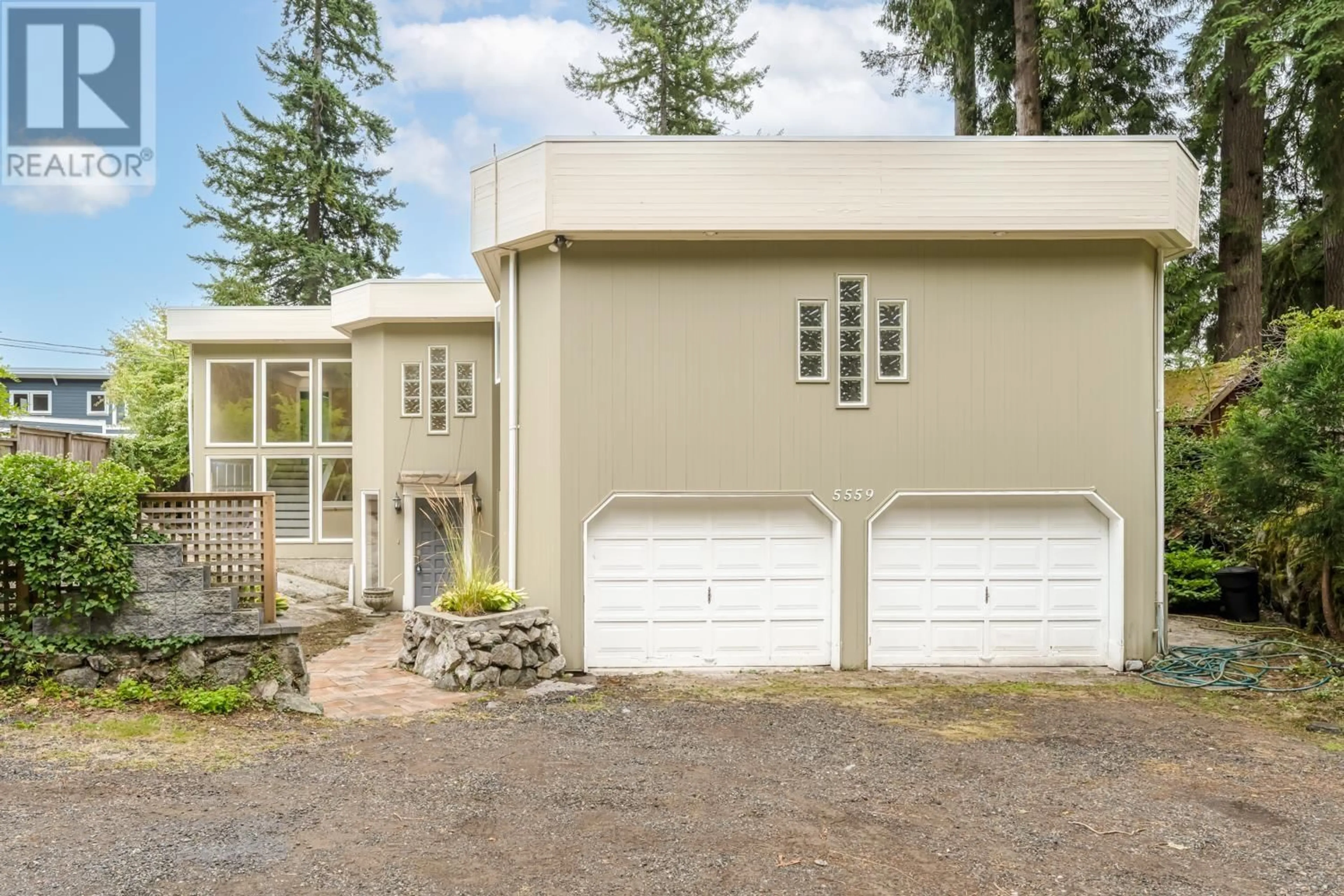 Frontside or backside of a home for 5559 INDIAN RIVER DRIVE, North Vancouver British Columbia V7G2T7