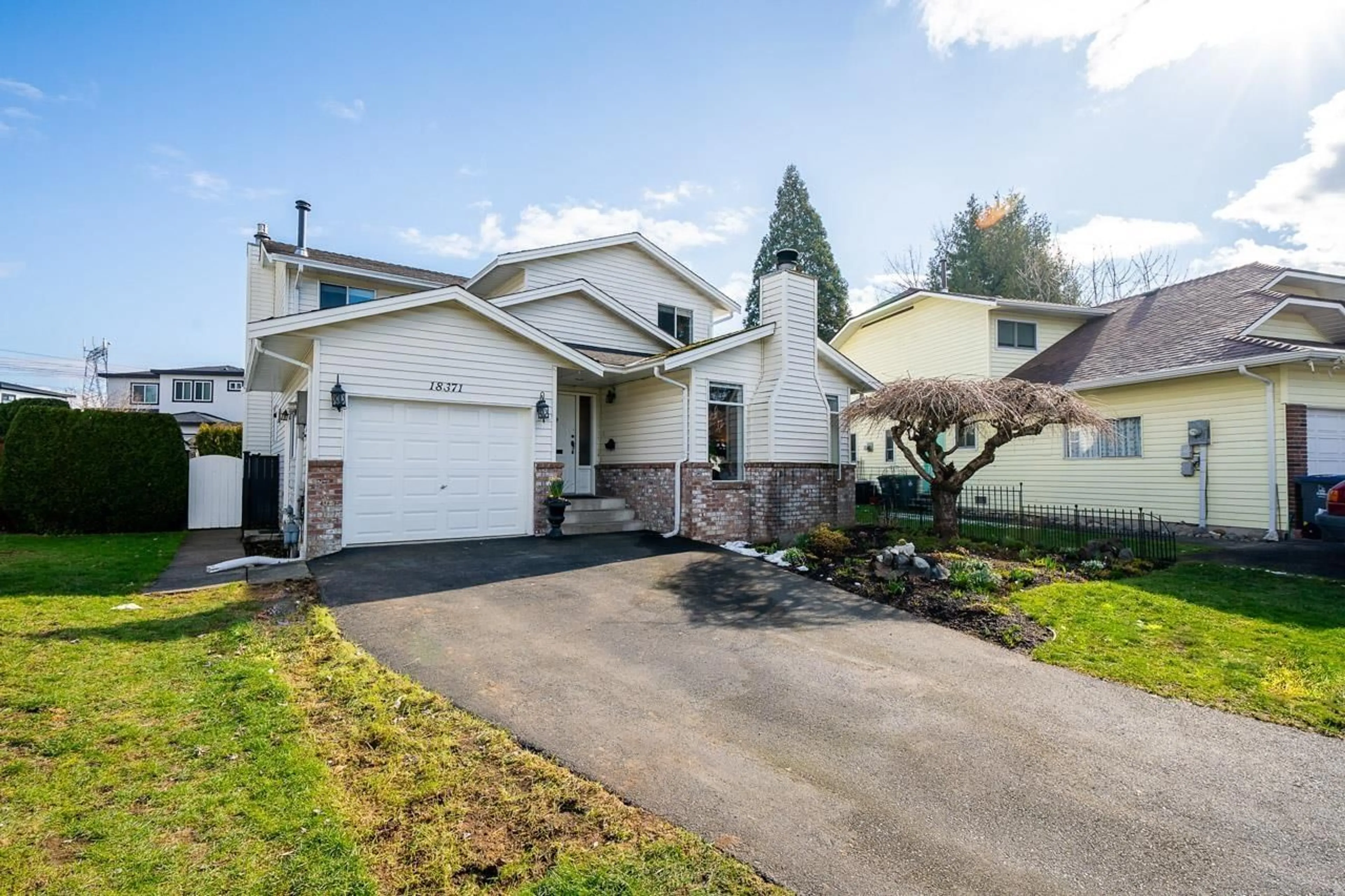 Frontside or backside of a home for 18371 59A AVENUE, Surrey British Columbia V3S6A4