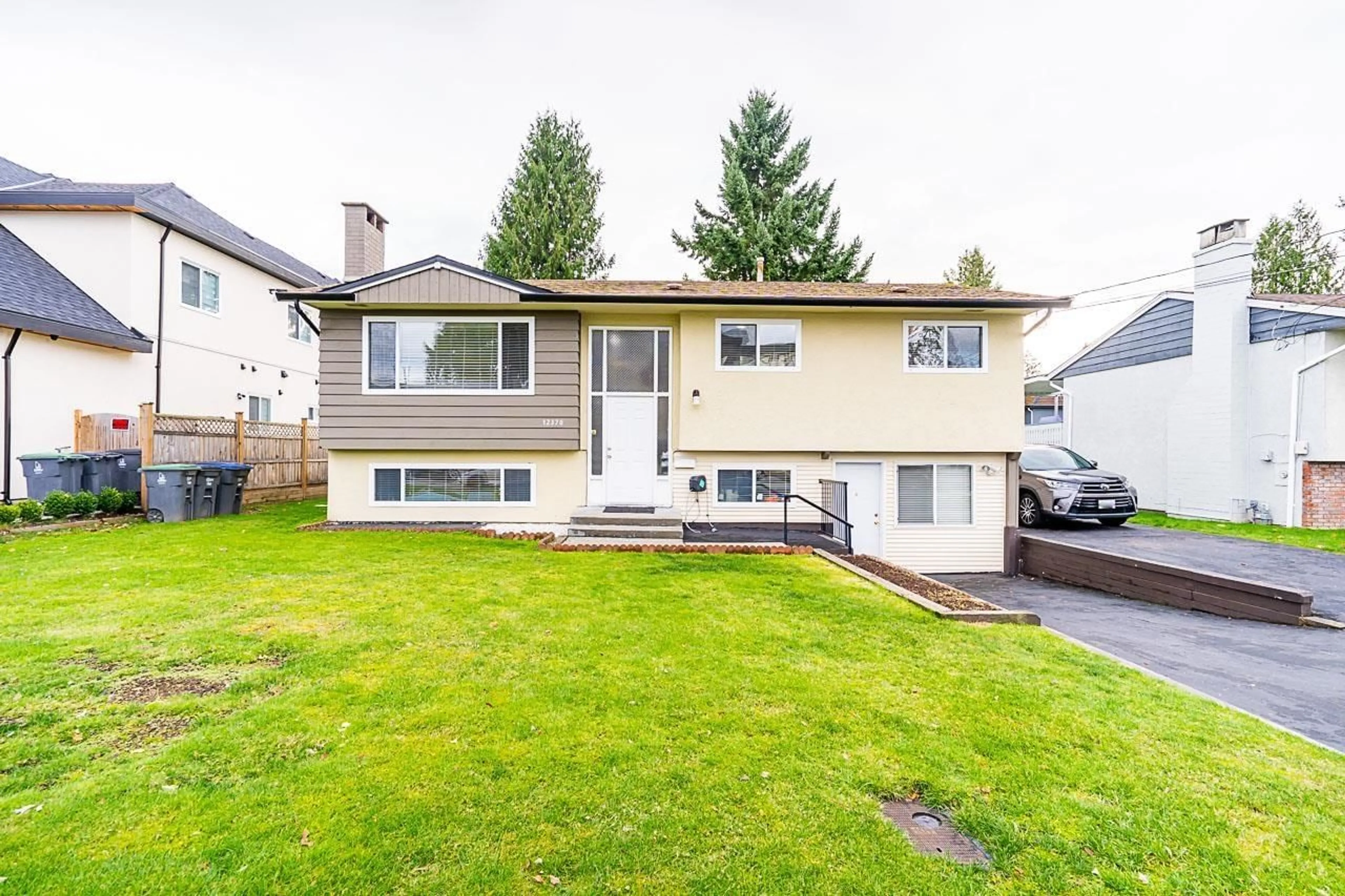 Frontside or backside of a home for 12370 95 AVENUE, Surrey British Columbia V3V1N8