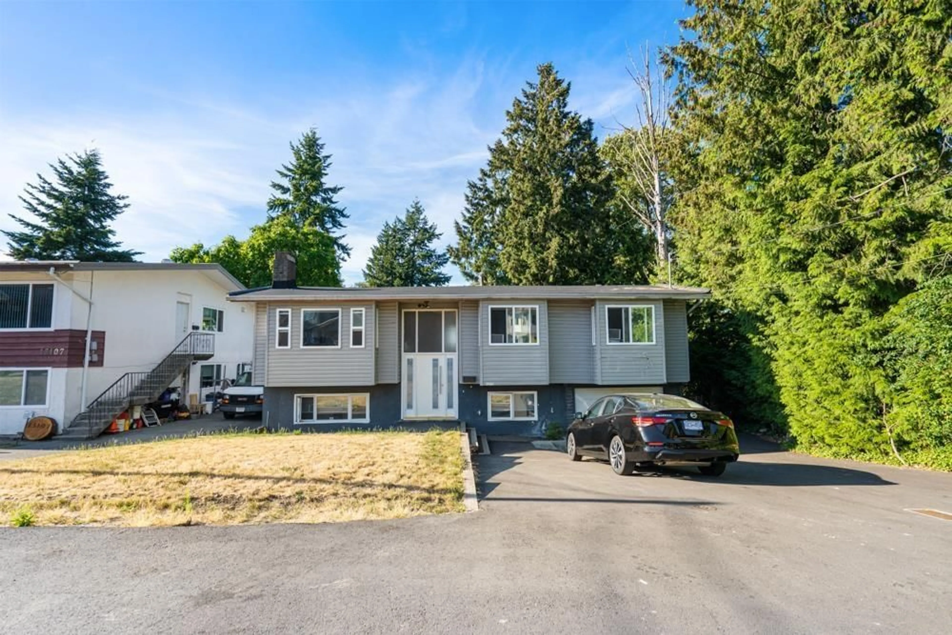 Frontside or backside of a home for 13115 107A AVENUE, Surrey British Columbia V3T2G9