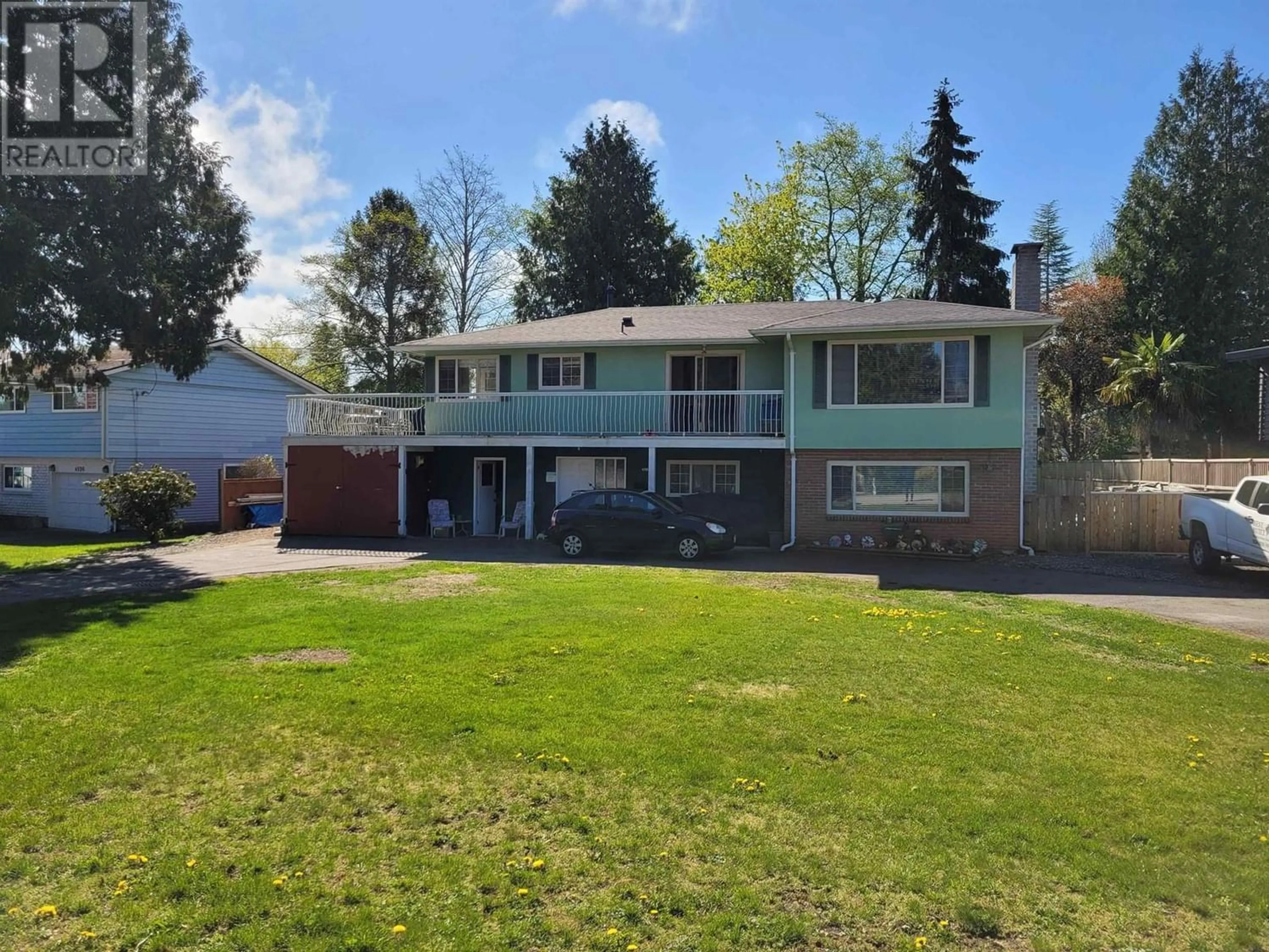 Frontside or backside of a home for 4984 10A AVENUE, Delta British Columbia V4M1X8